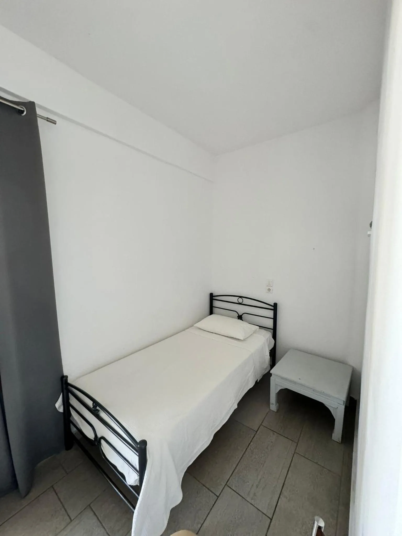 Bed in Deep Blue Rooms & Apartments