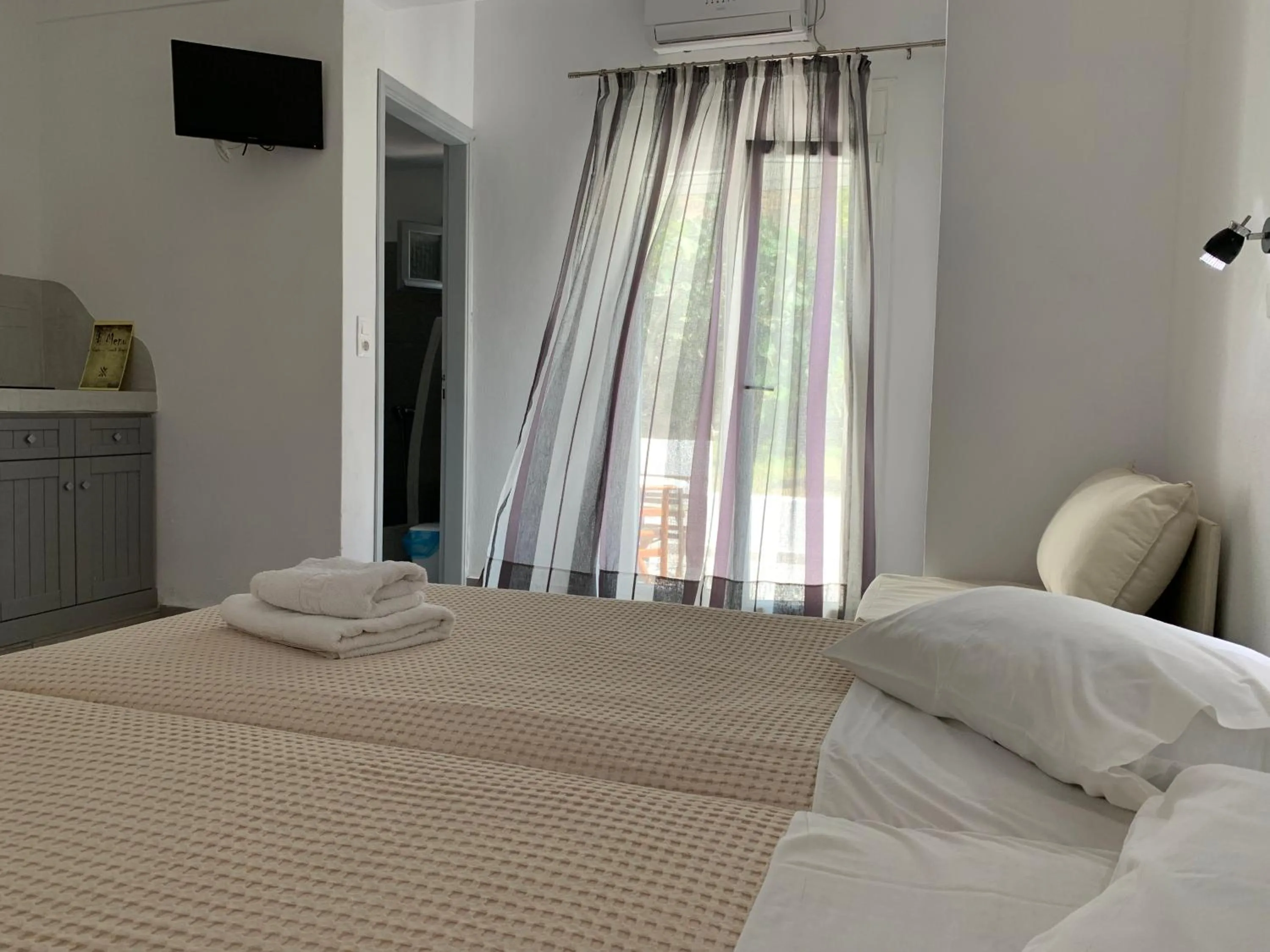 Bed in Deep Blue Rooms & Apartments