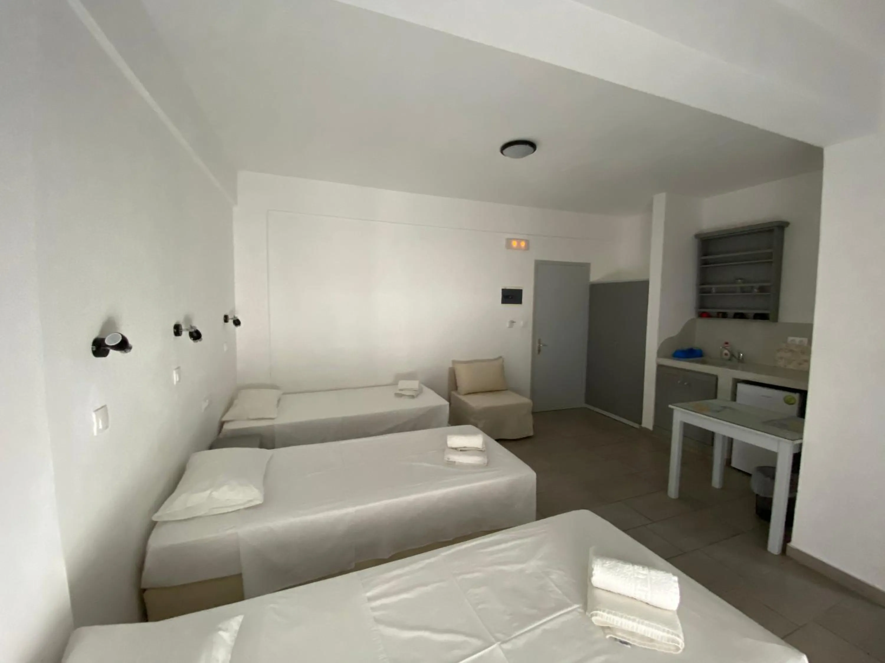 Bed in Deep Blue Rooms & Apartments