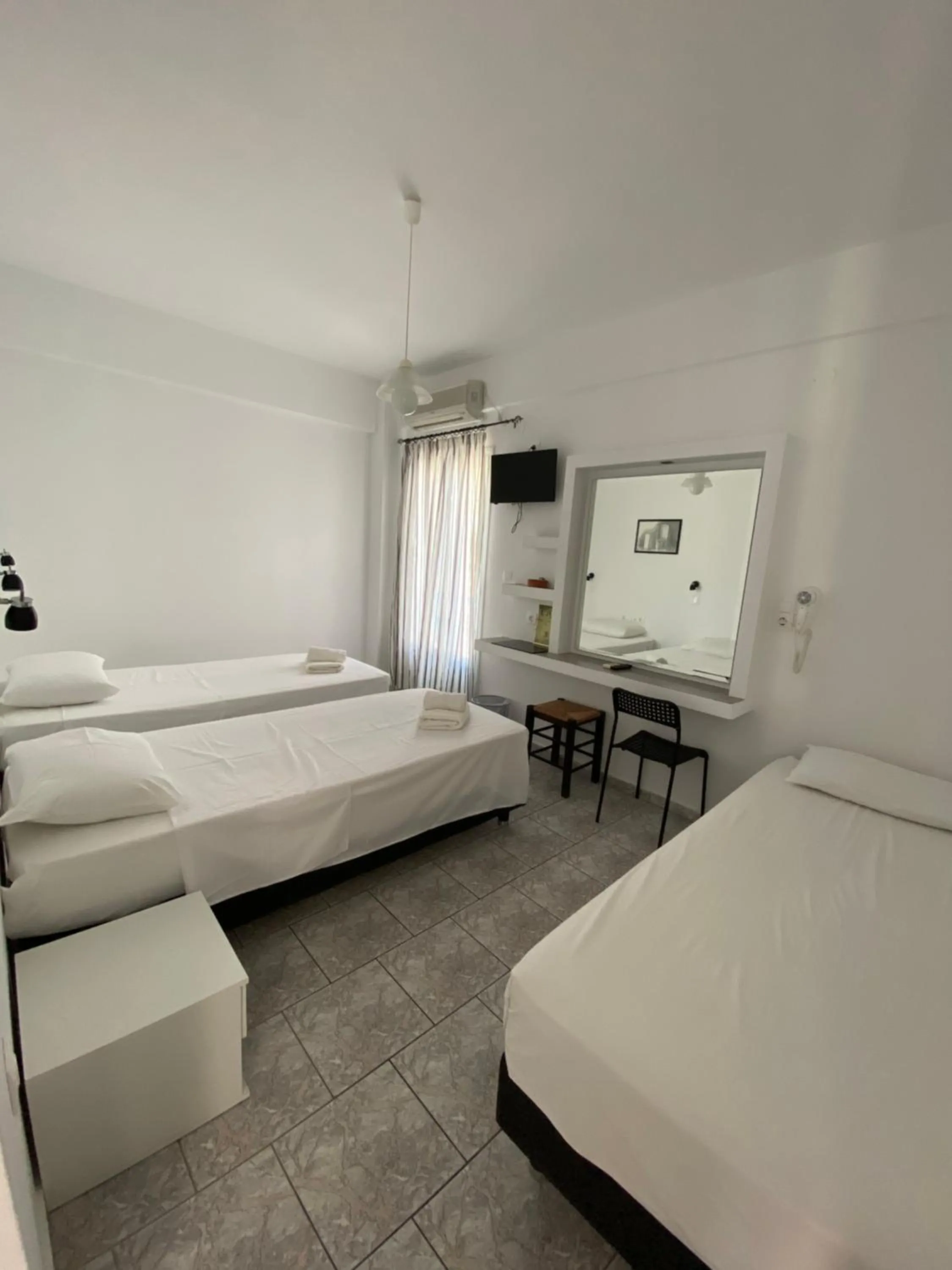 Bed in Deep Blue Rooms & Apartments