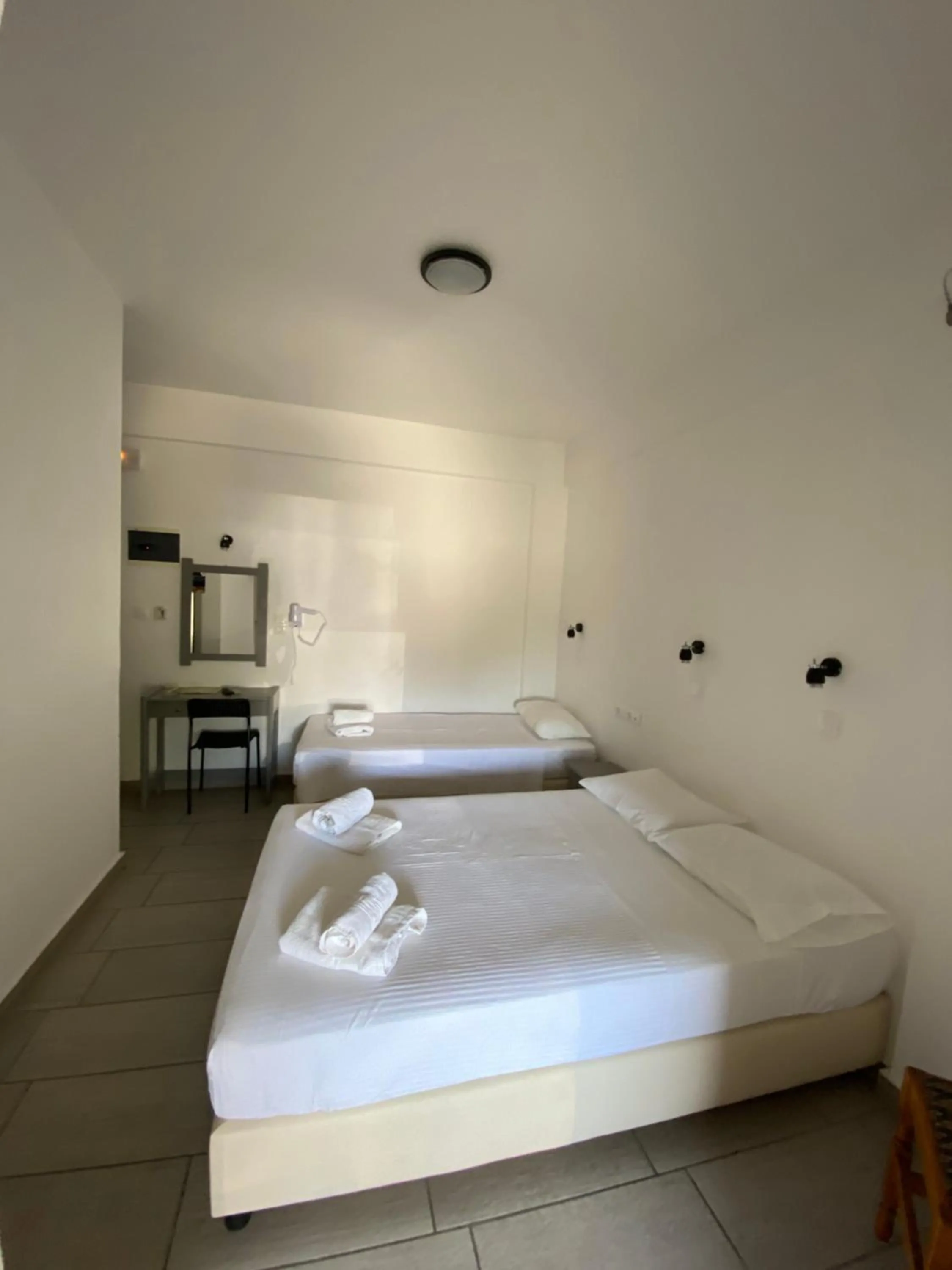 Bed in Deep Blue Rooms & Apartments