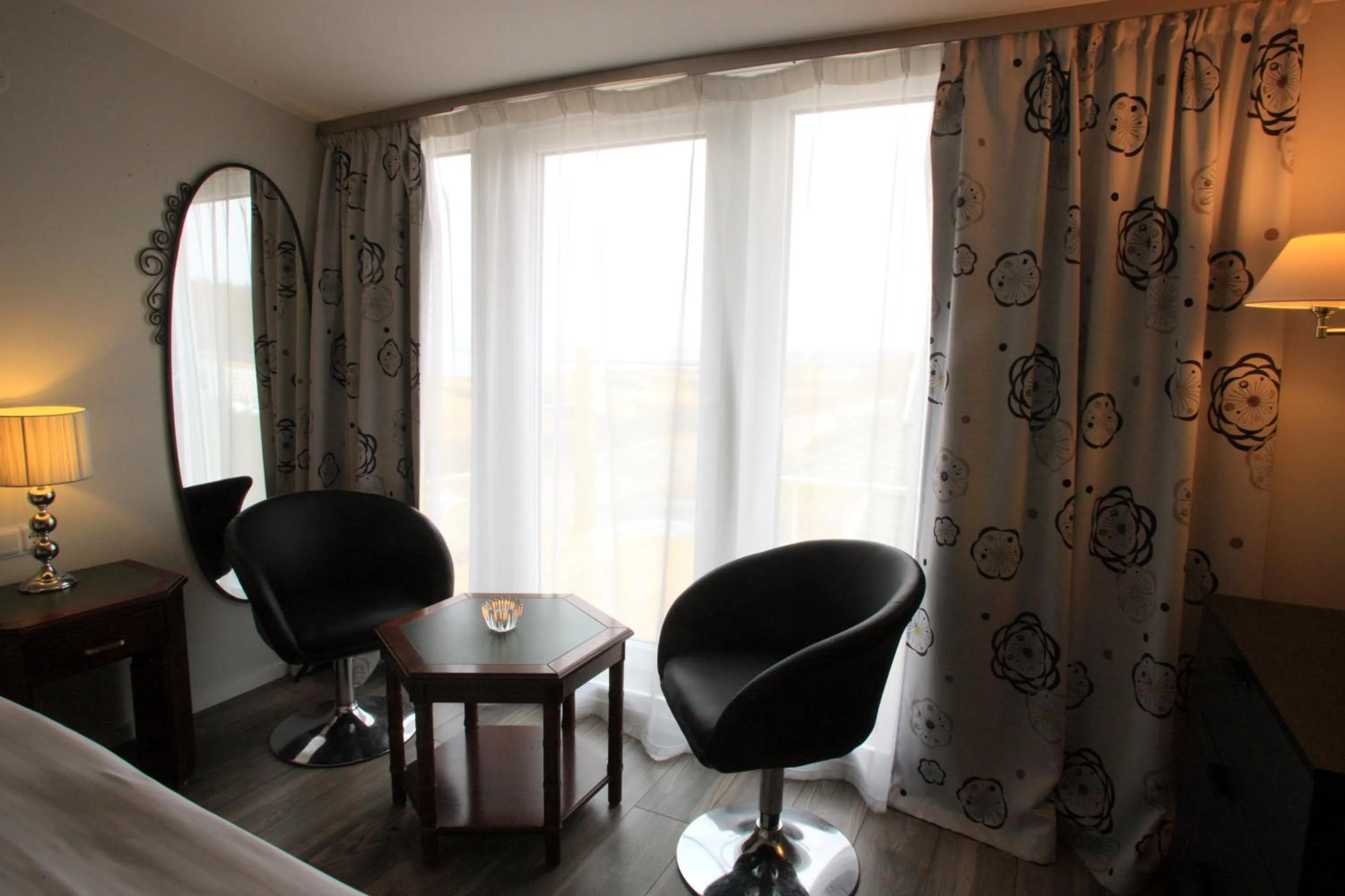 Seating area, Bed in Vejby Strand Hotel