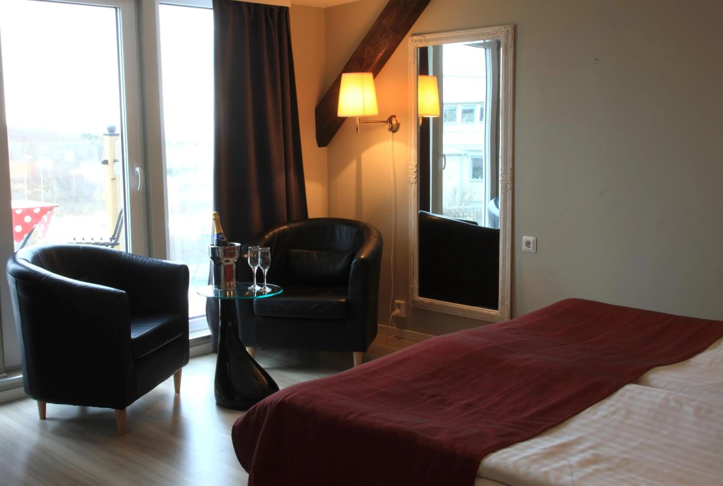 Seating area, Bed in Vejby Strand Hotel