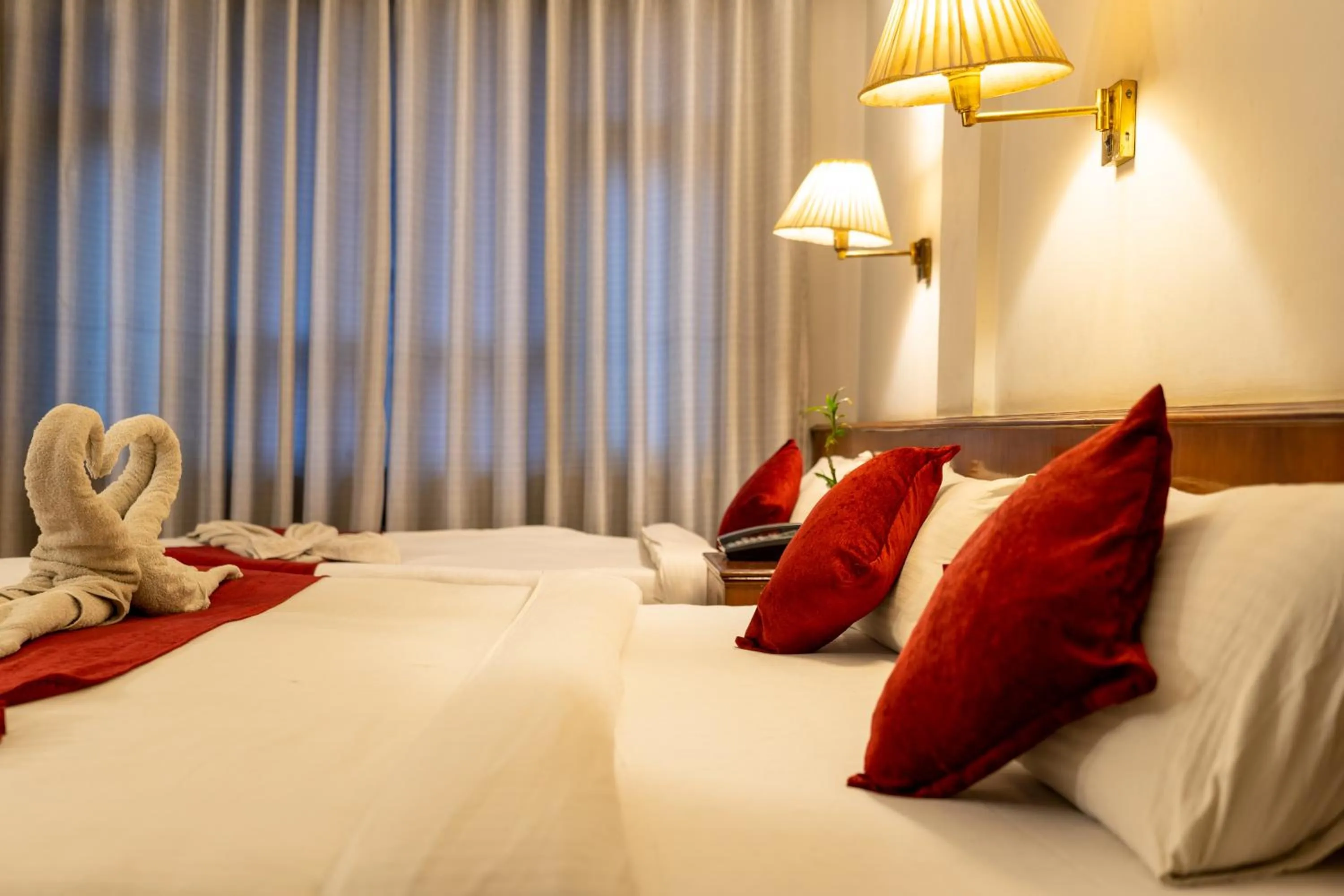 Bed in Mystic Homes Hotel