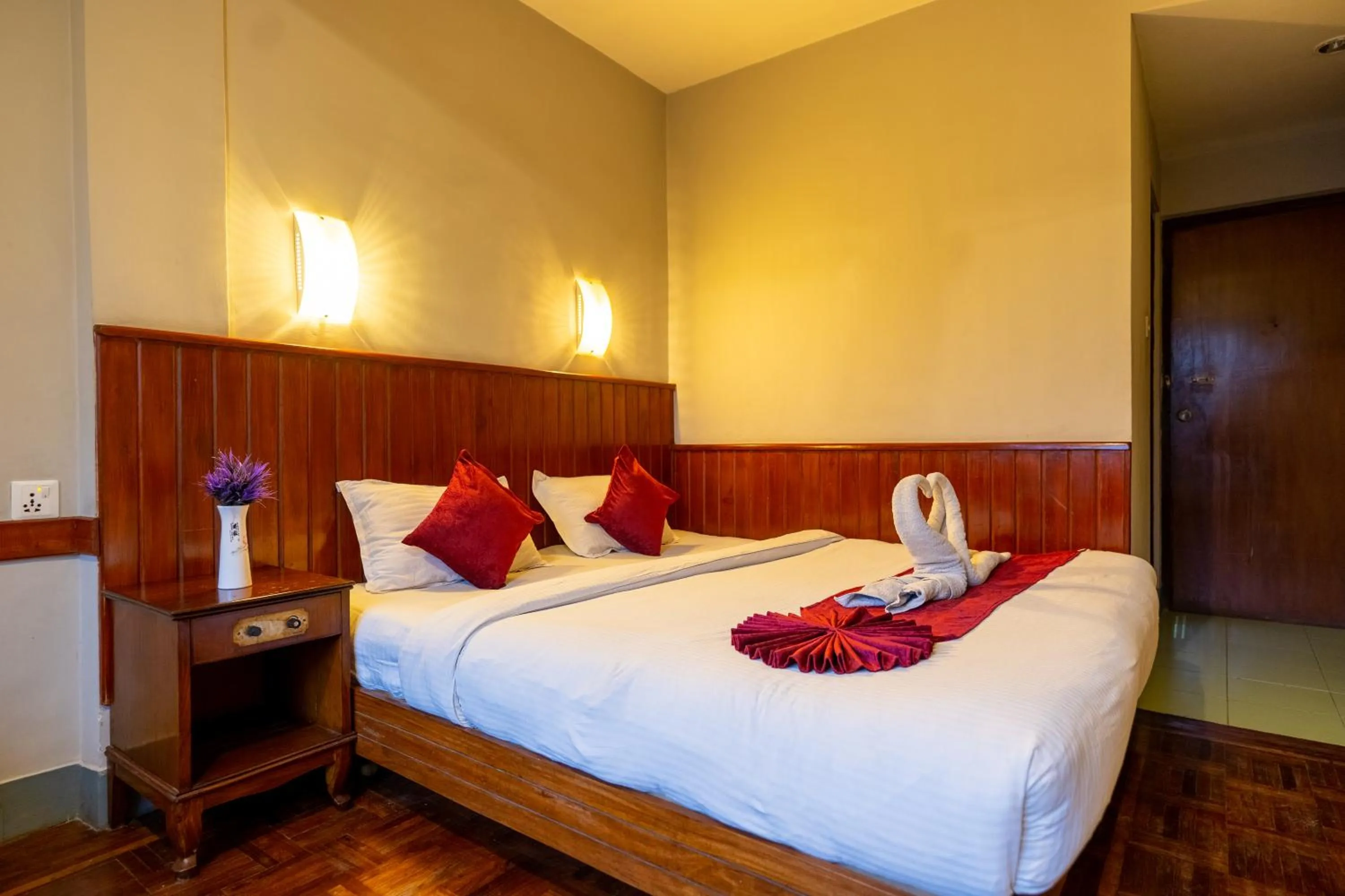 Bed in Mystic Homes Hotel