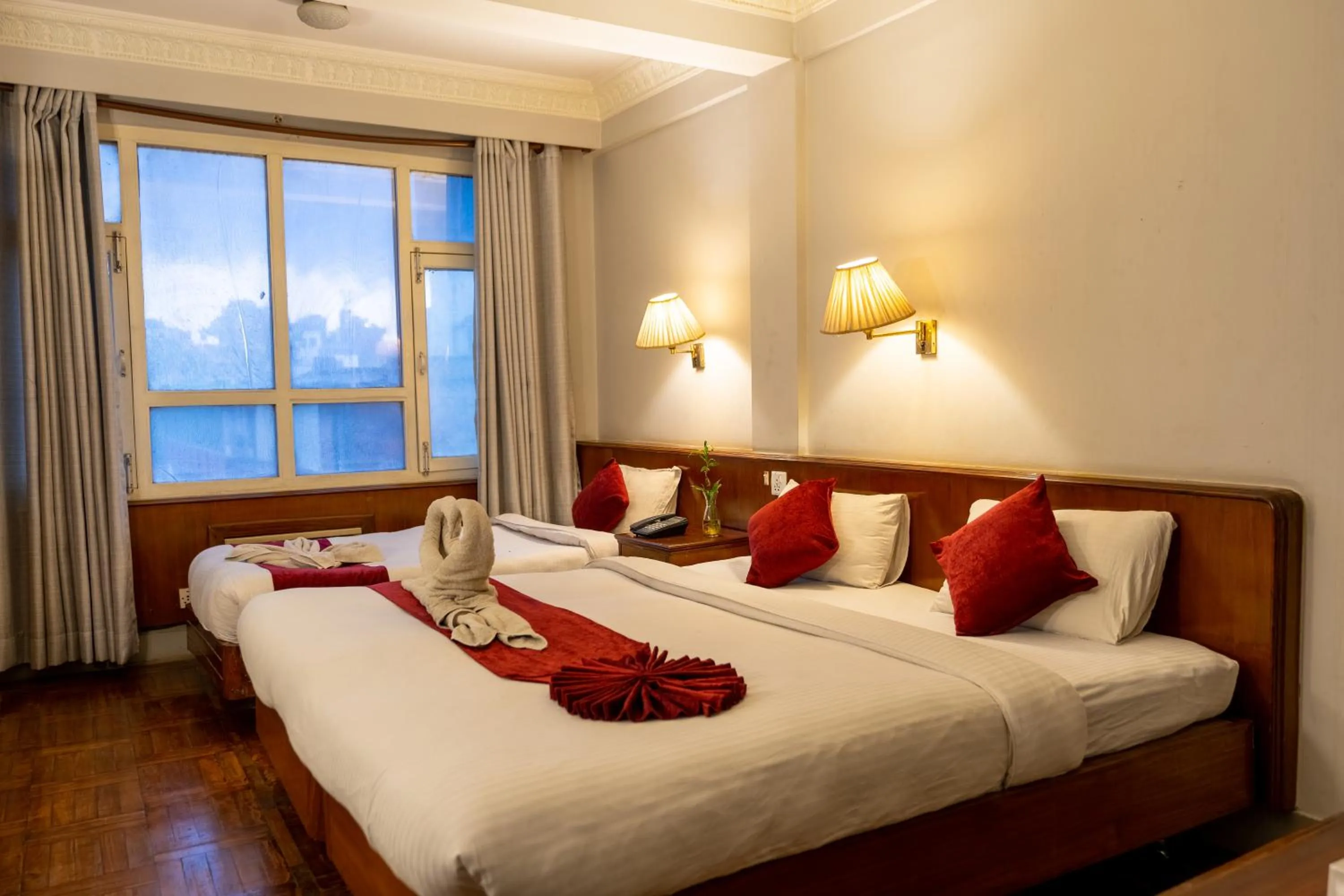 Bed in Mystic Homes Hotel