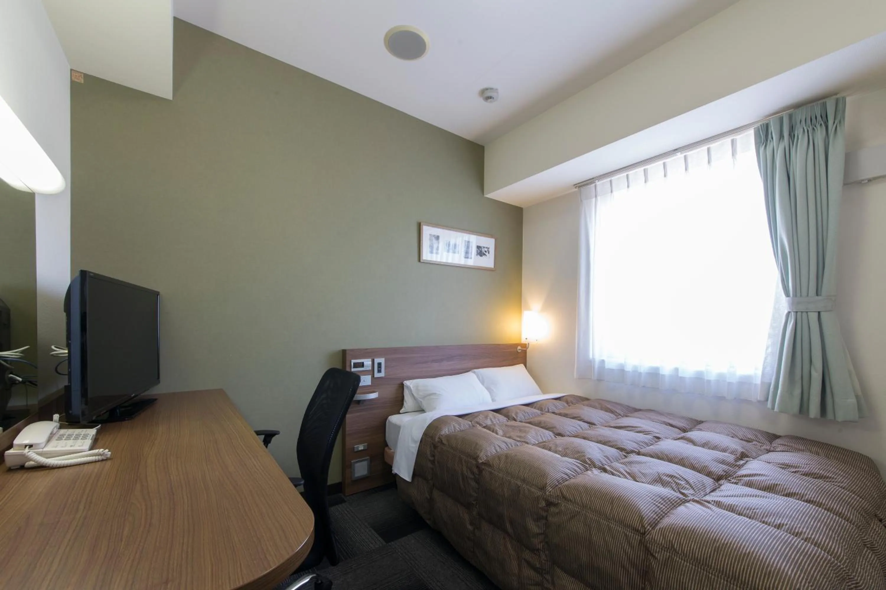 Photo of the whole room, Bed in Hotel Econo Kameyama