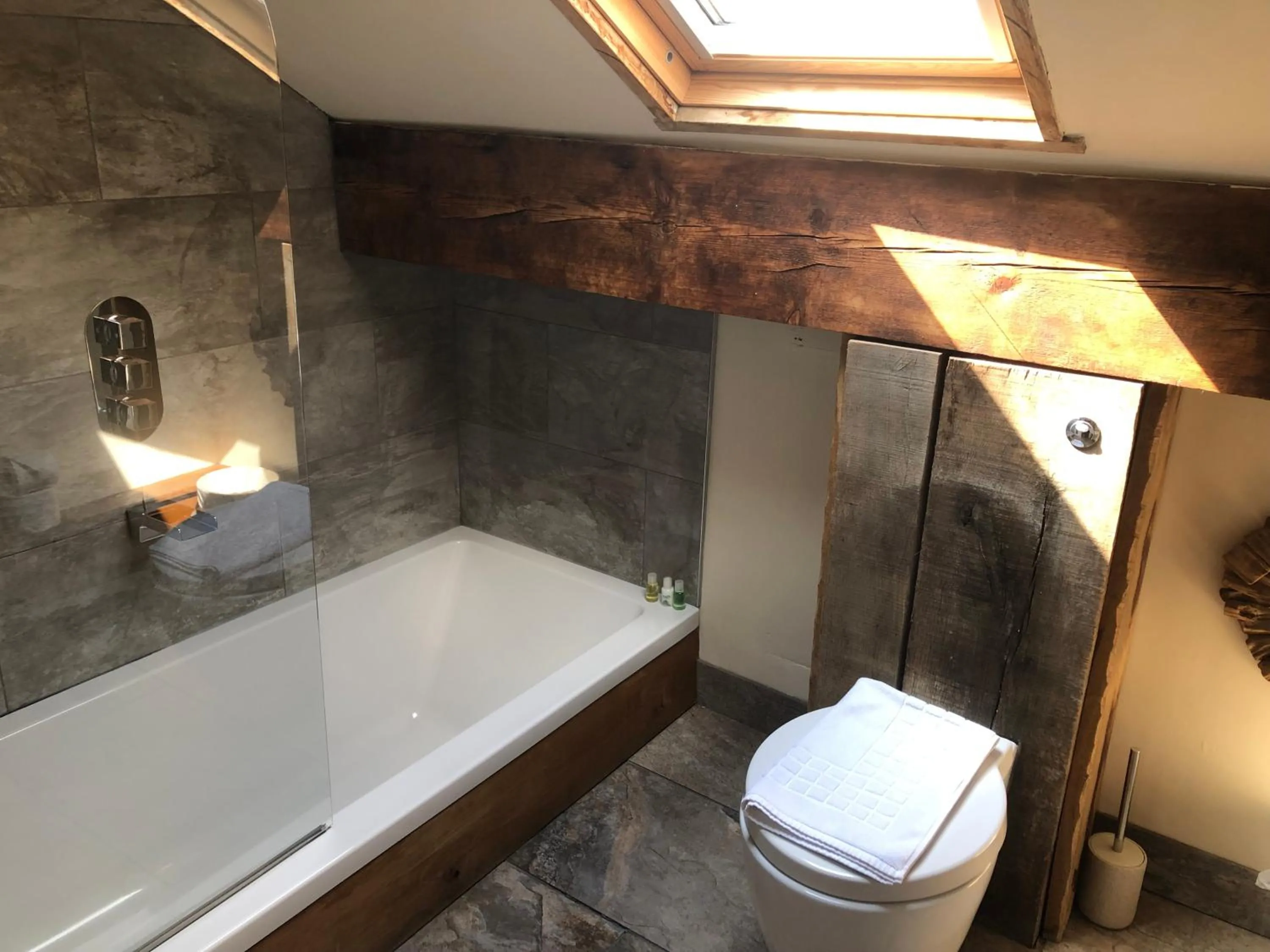 Bathroom in Romneys Apartments & Suites