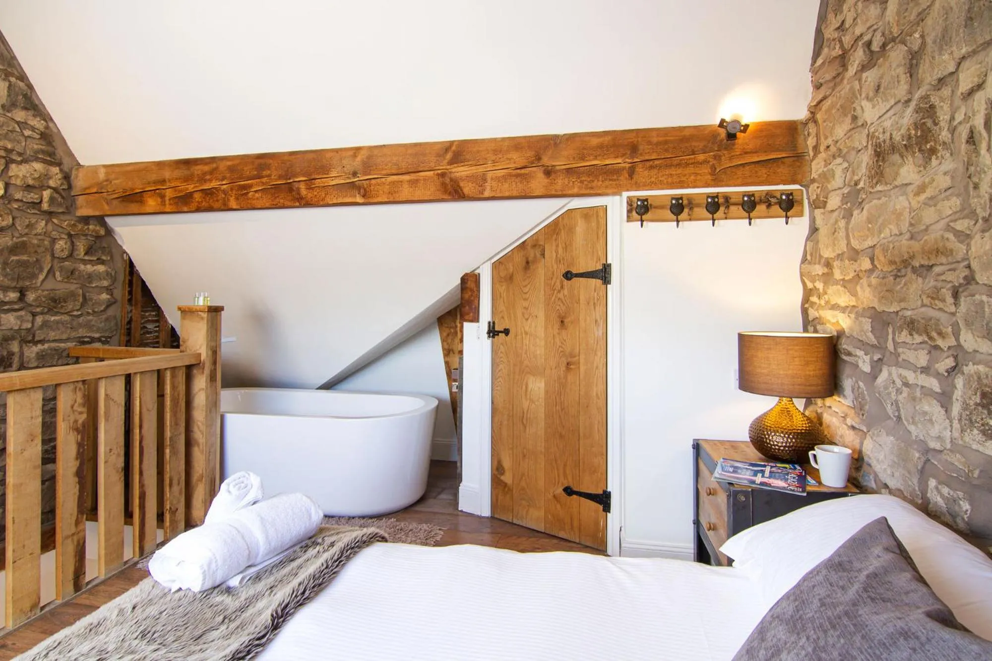 Bed in Romneys Apartments & Suites