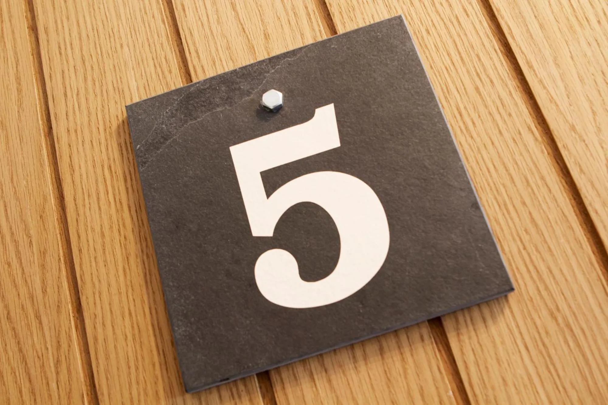 Property logo or sign in Romneys Apartments & Suites