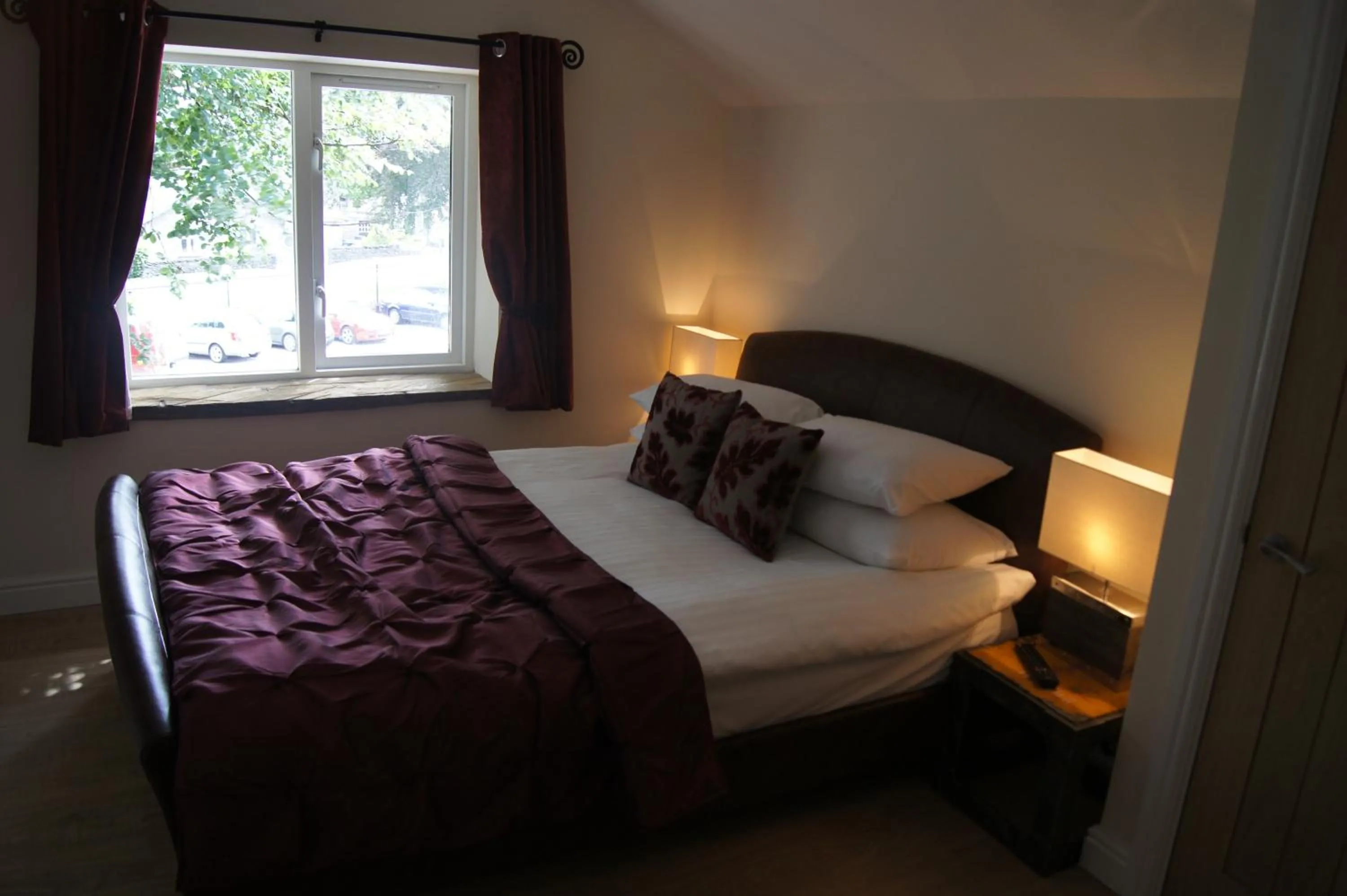 Bedroom, Bed in Romneys Apartments & Suites