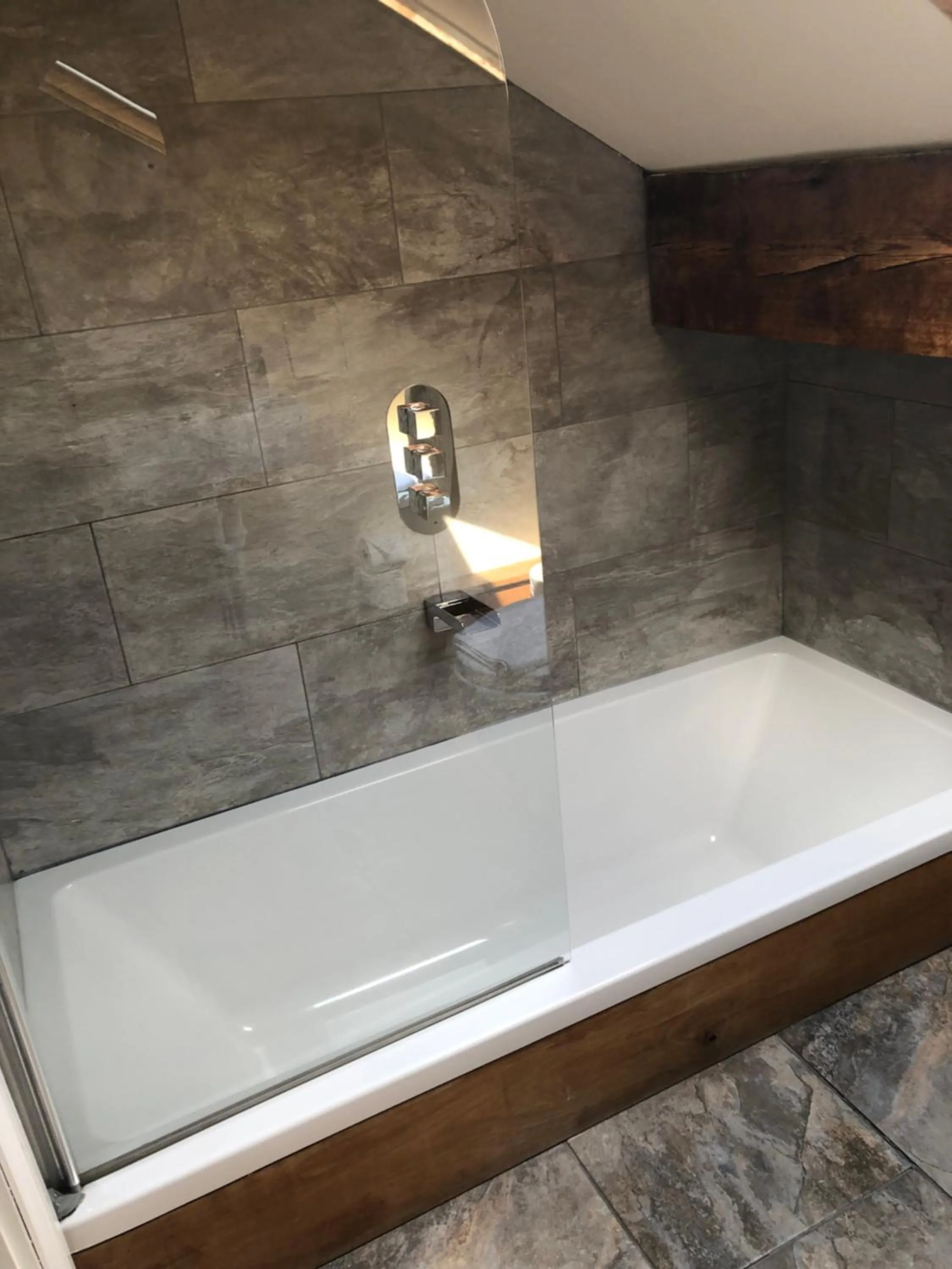 Bathroom in Romneys Apartments & Suites