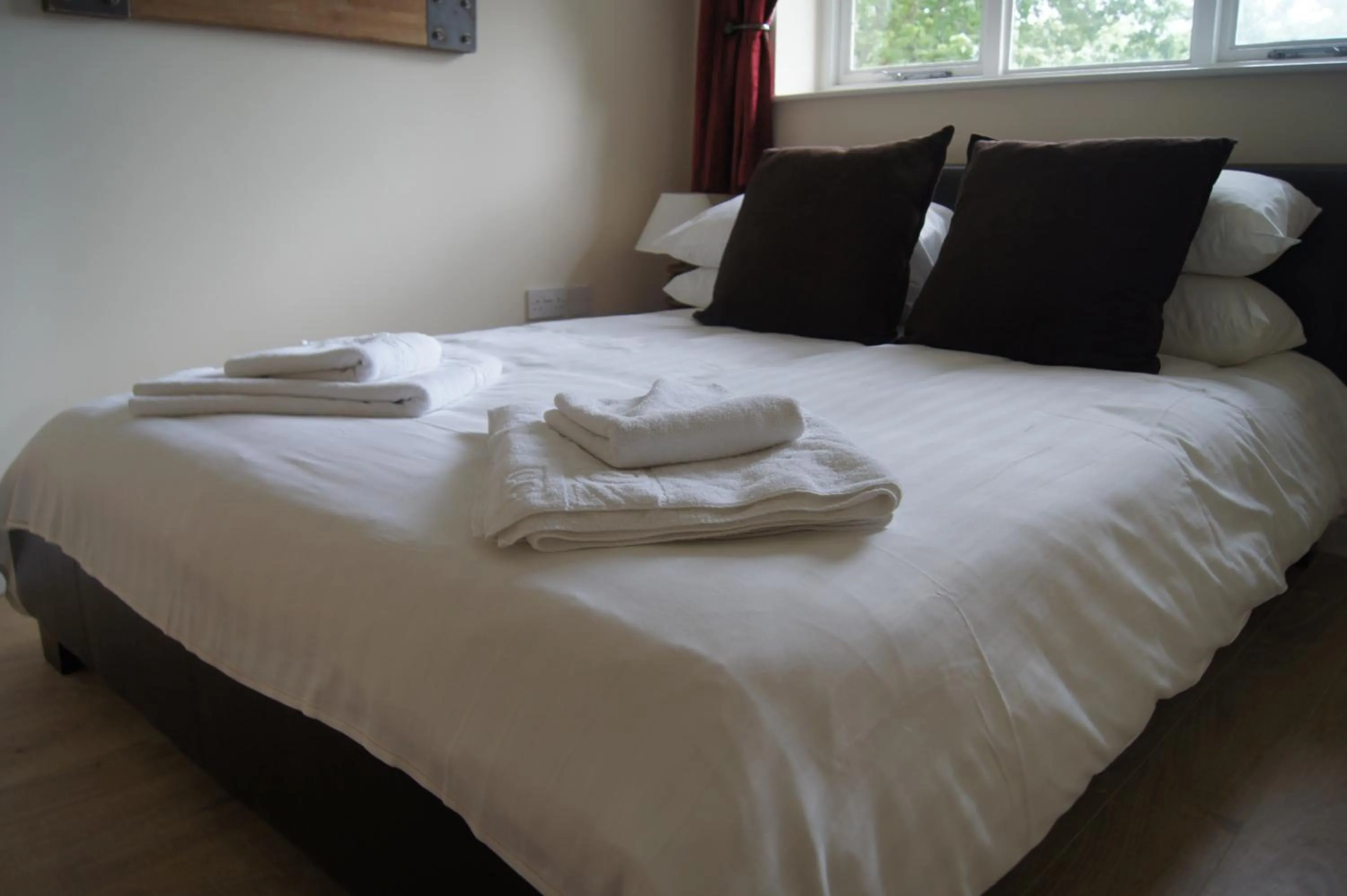 Bedroom, Bed in Romneys Apartments & Suites