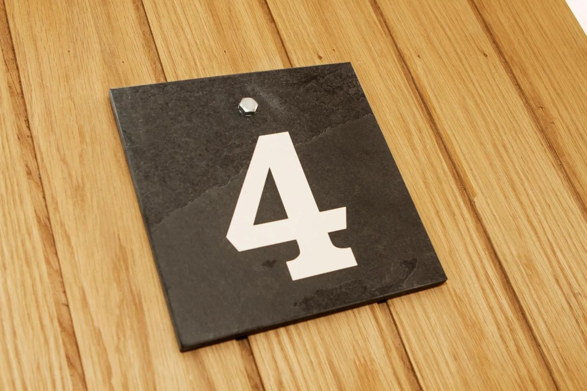 Property logo or sign in Romneys Apartments & Suites