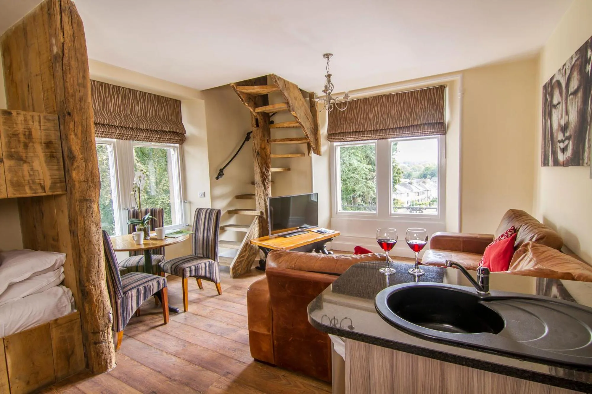 Kitchen or kitchenette in Romneys Apartments & Suites