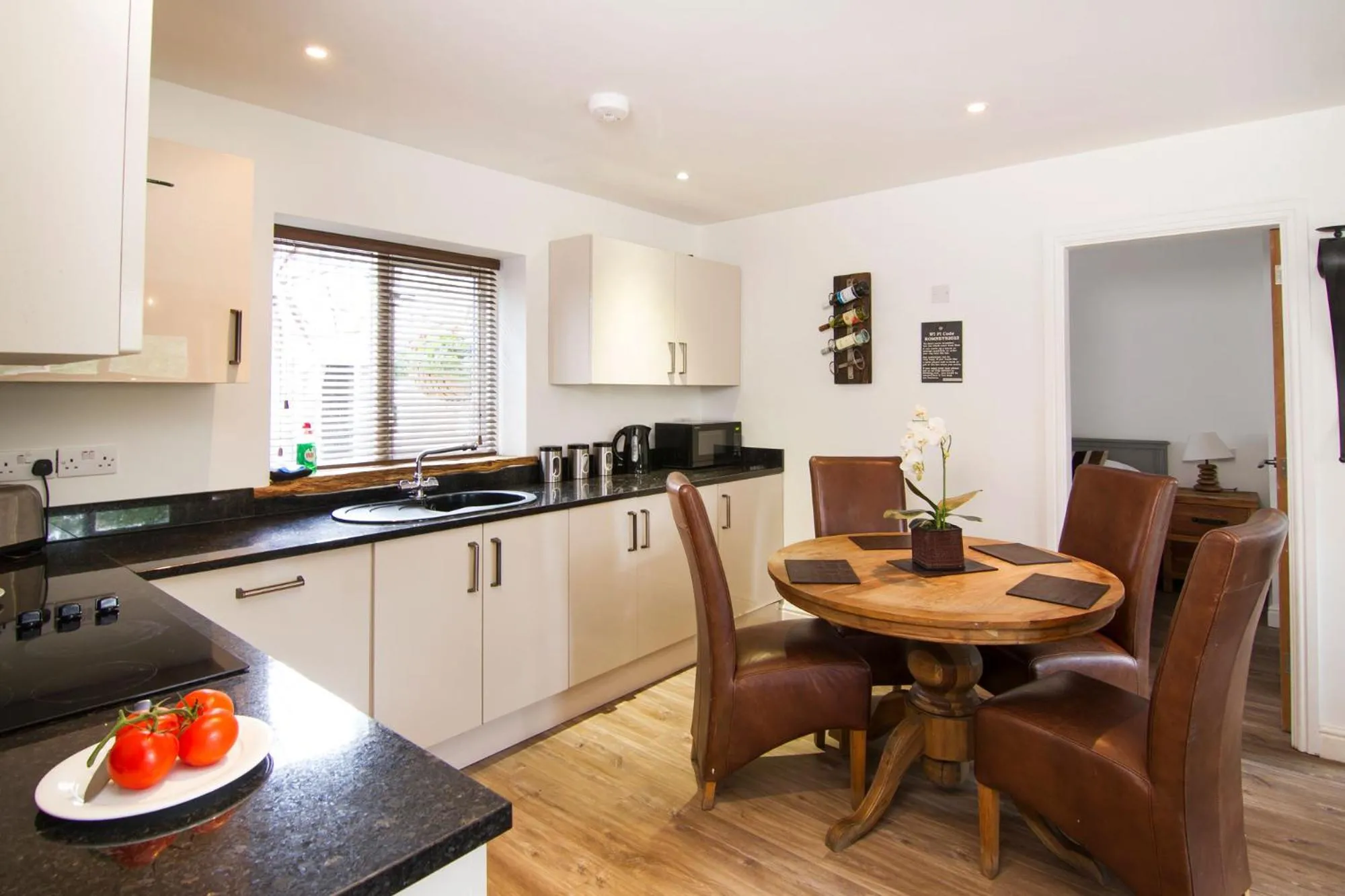 Kitchen or kitchenette in Romneys Apartments & Suites