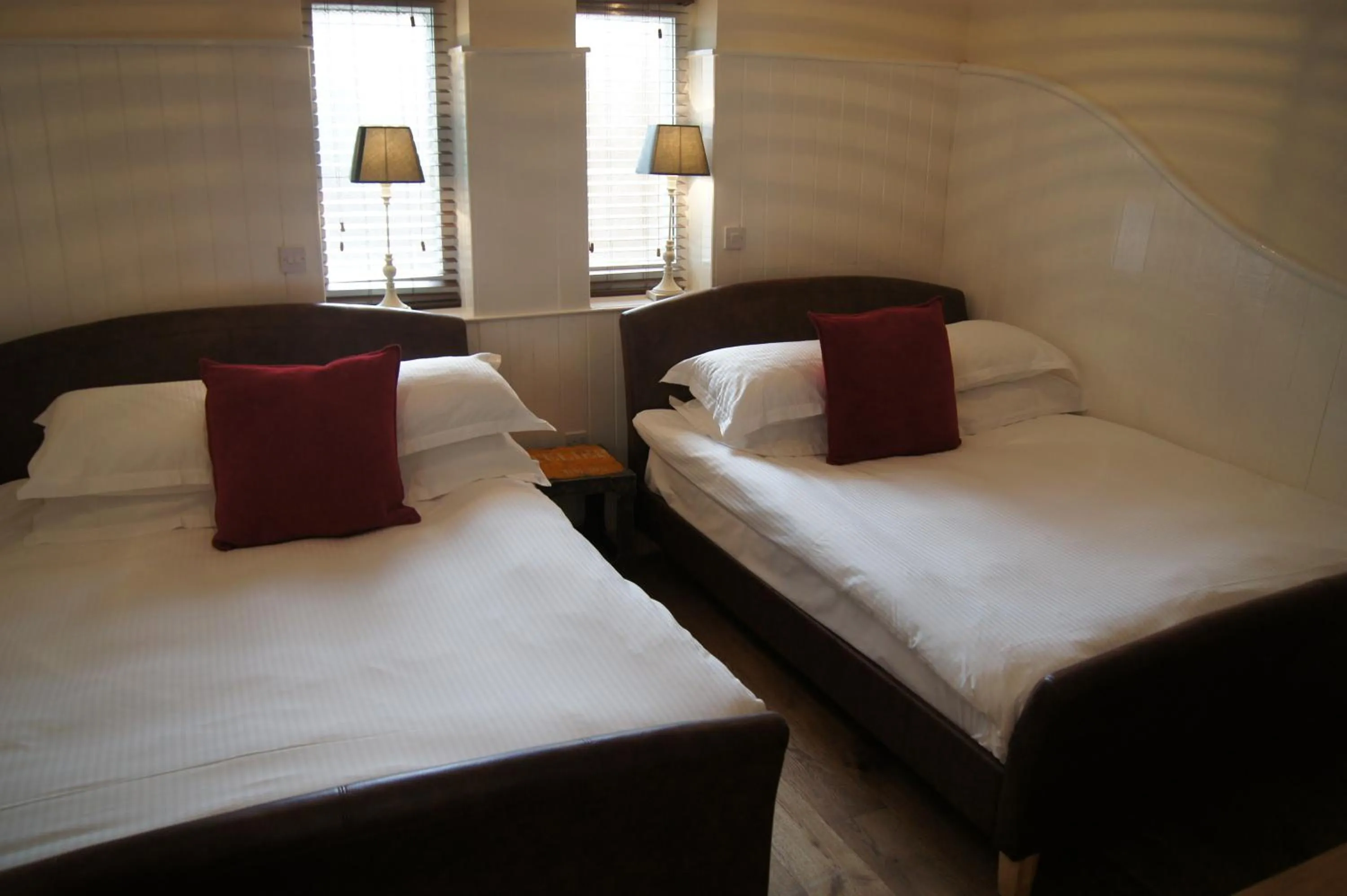 Bedroom, Bed in Romneys Apartments & Suites
