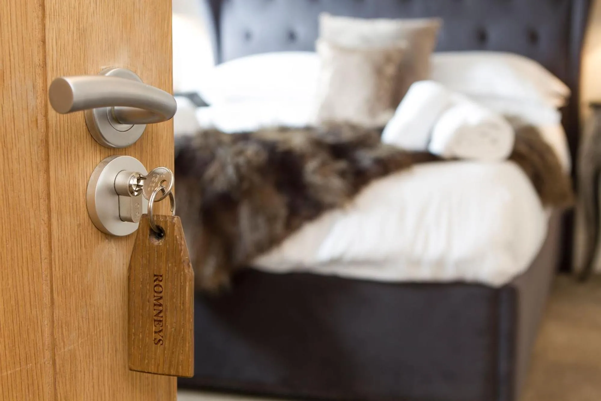 Bed in Romneys Apartments & Suites