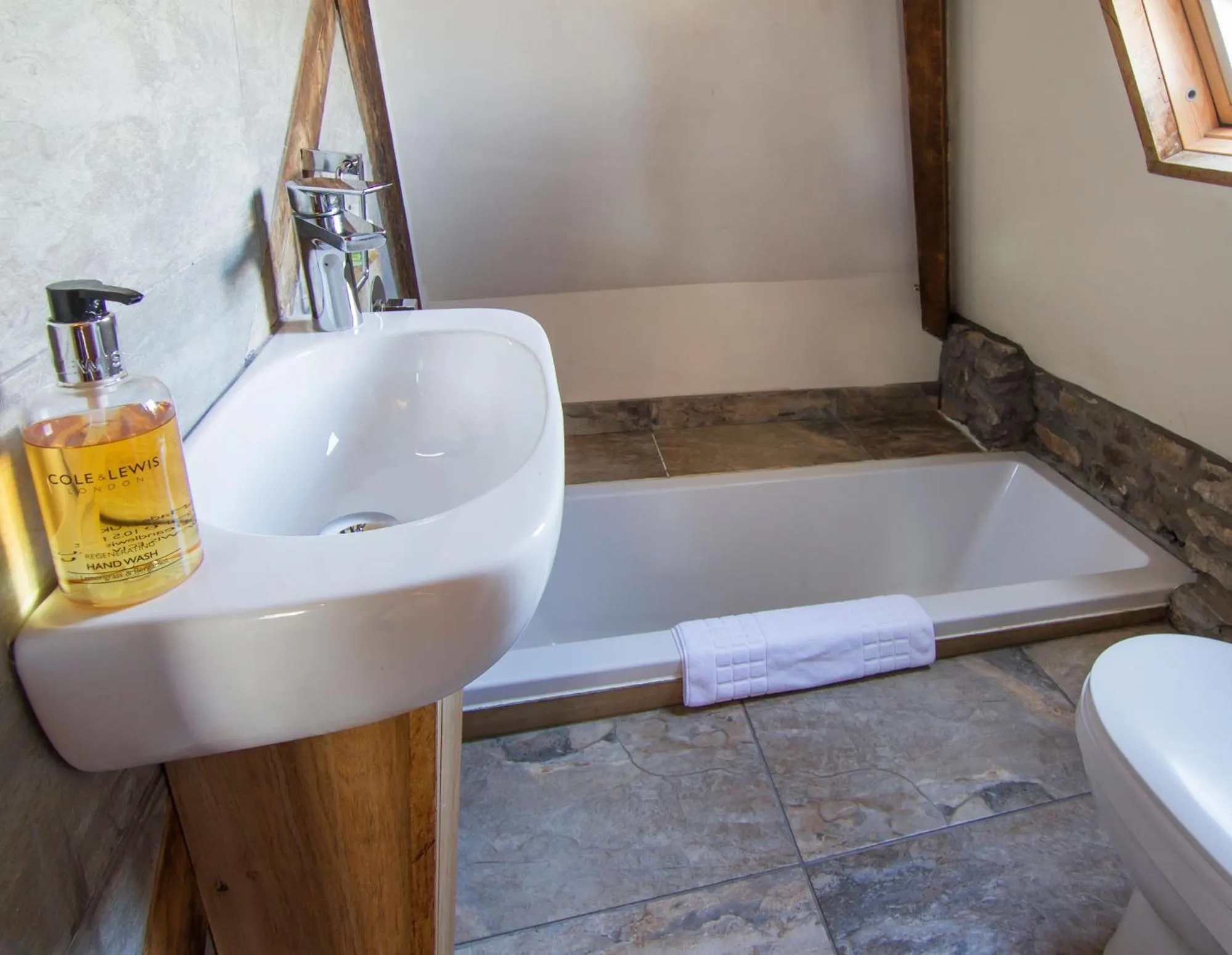 Bathroom in Romneys Apartments & Suites