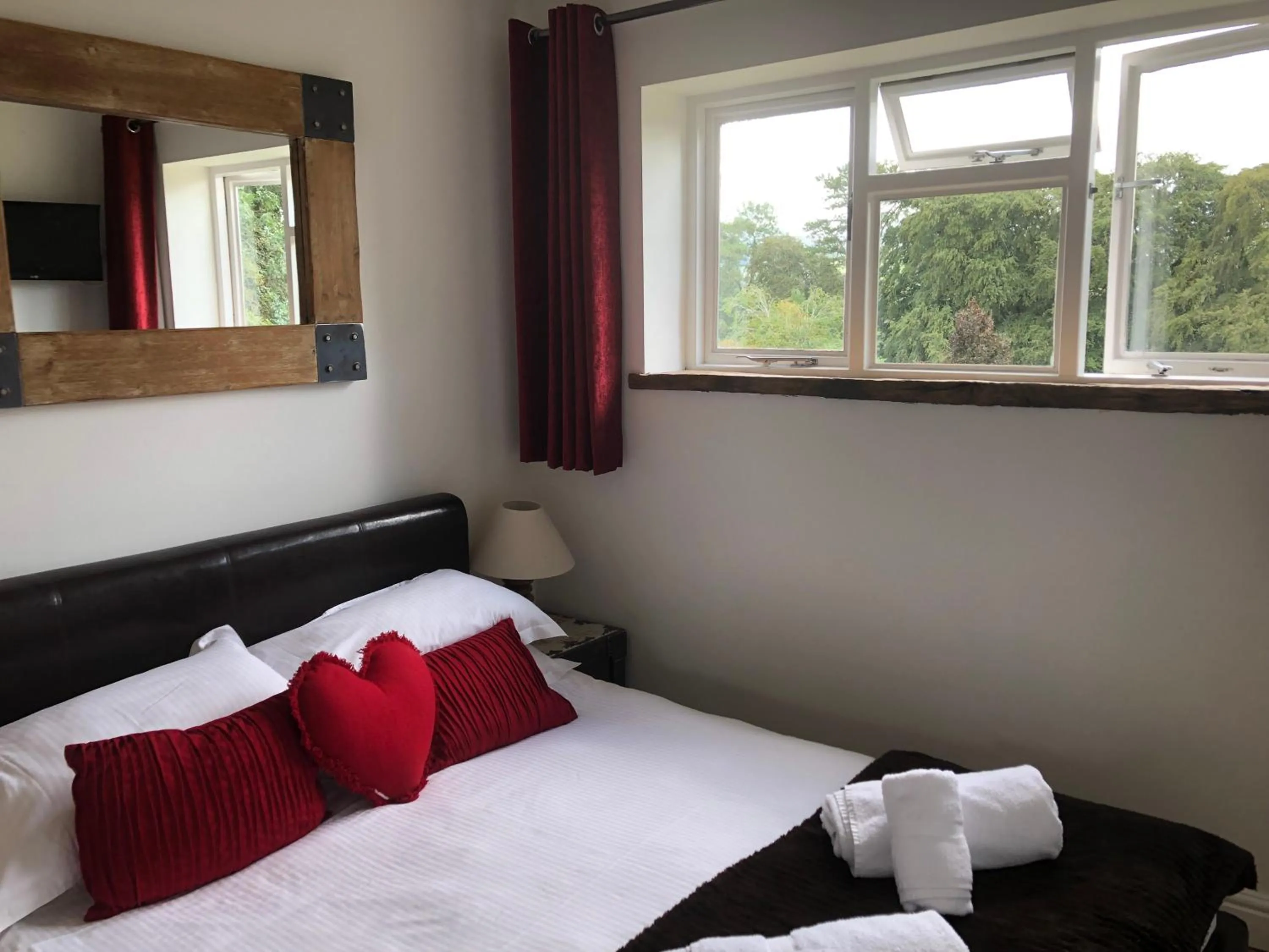 Bedroom, Bed in Romneys Apartments & Suites