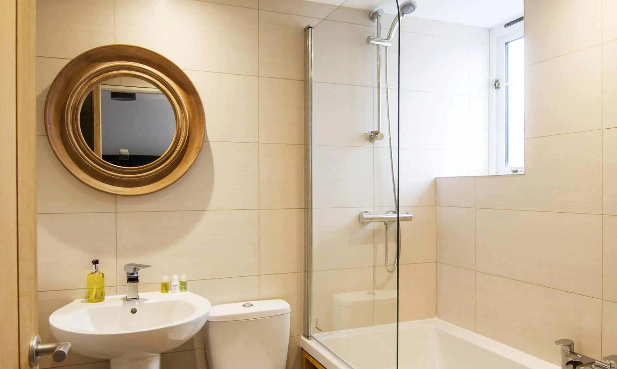 Bathroom in Romneys Apartments & Suites