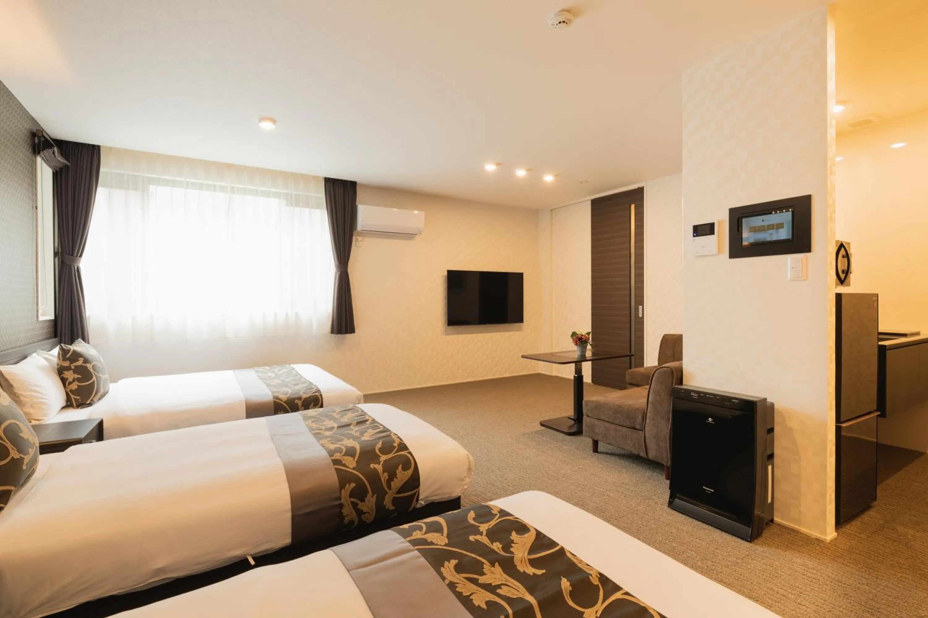 Photo of the whole room, Bed in GRAND BASE Nagasaki Ekimae