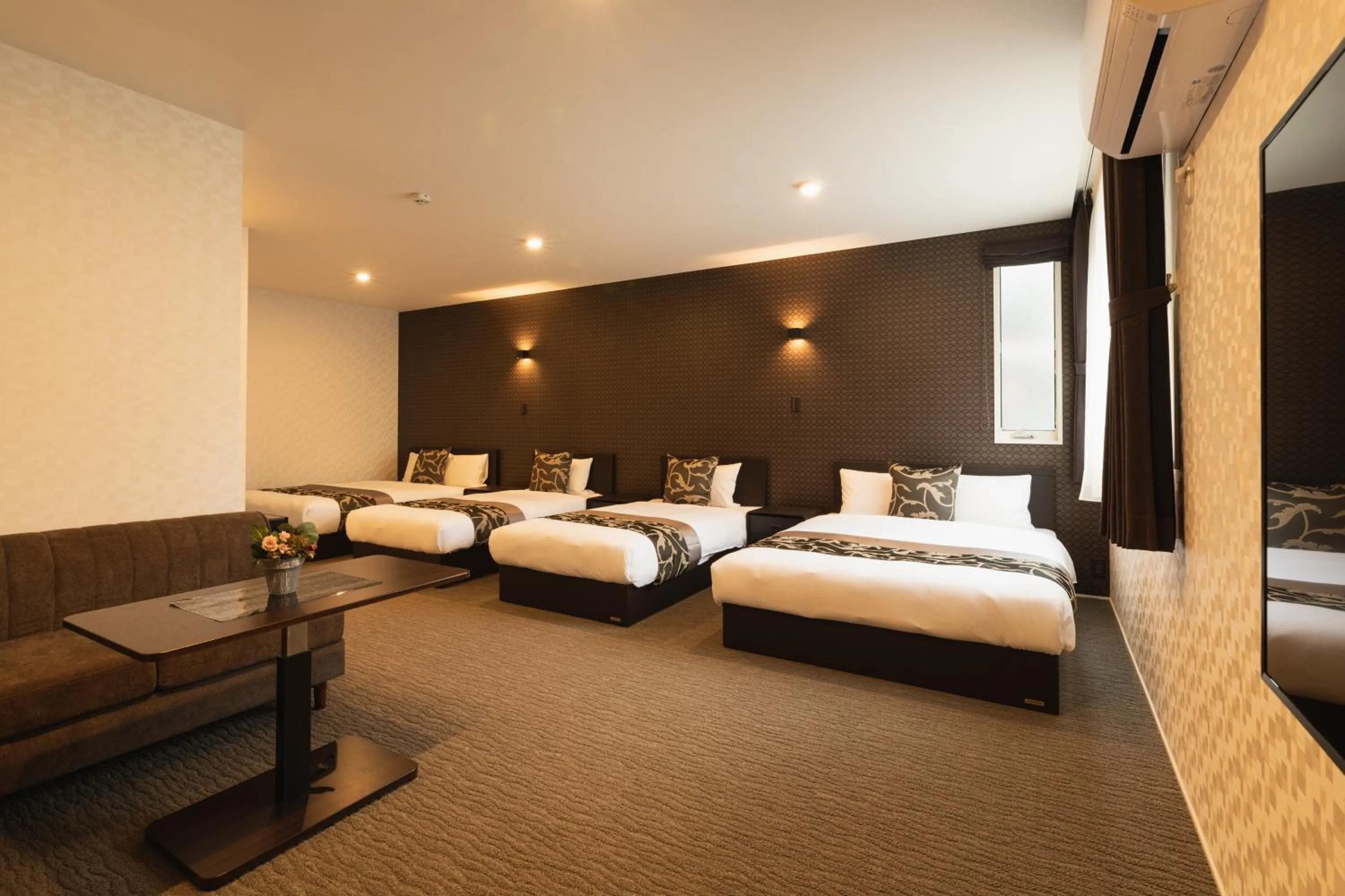 Photo of the whole room, Bed in GRAND BASE Nagasaki Ekimae