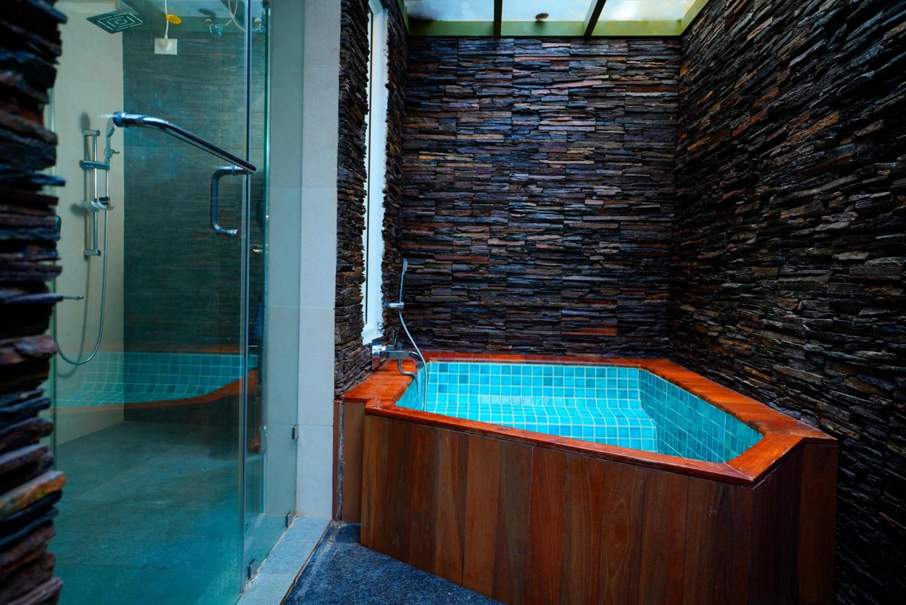 Bathroom in Kuruva Island Resort And Spa - By KABINI BREEZE