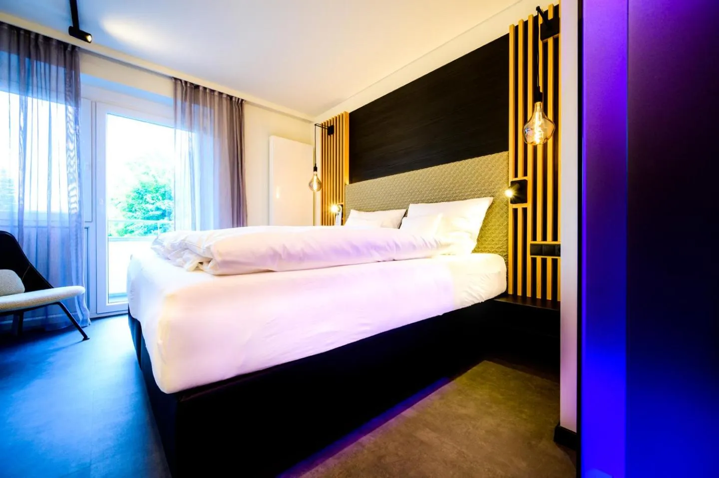 Bed in Aqua Blu Hotel