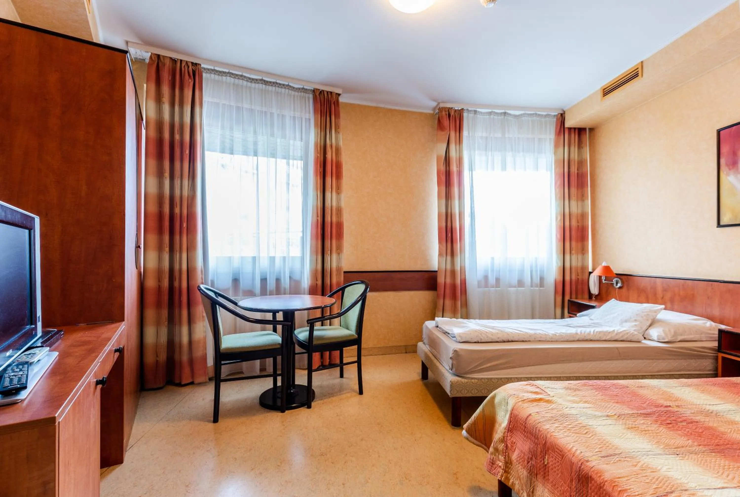 Bed in Corner Motel
