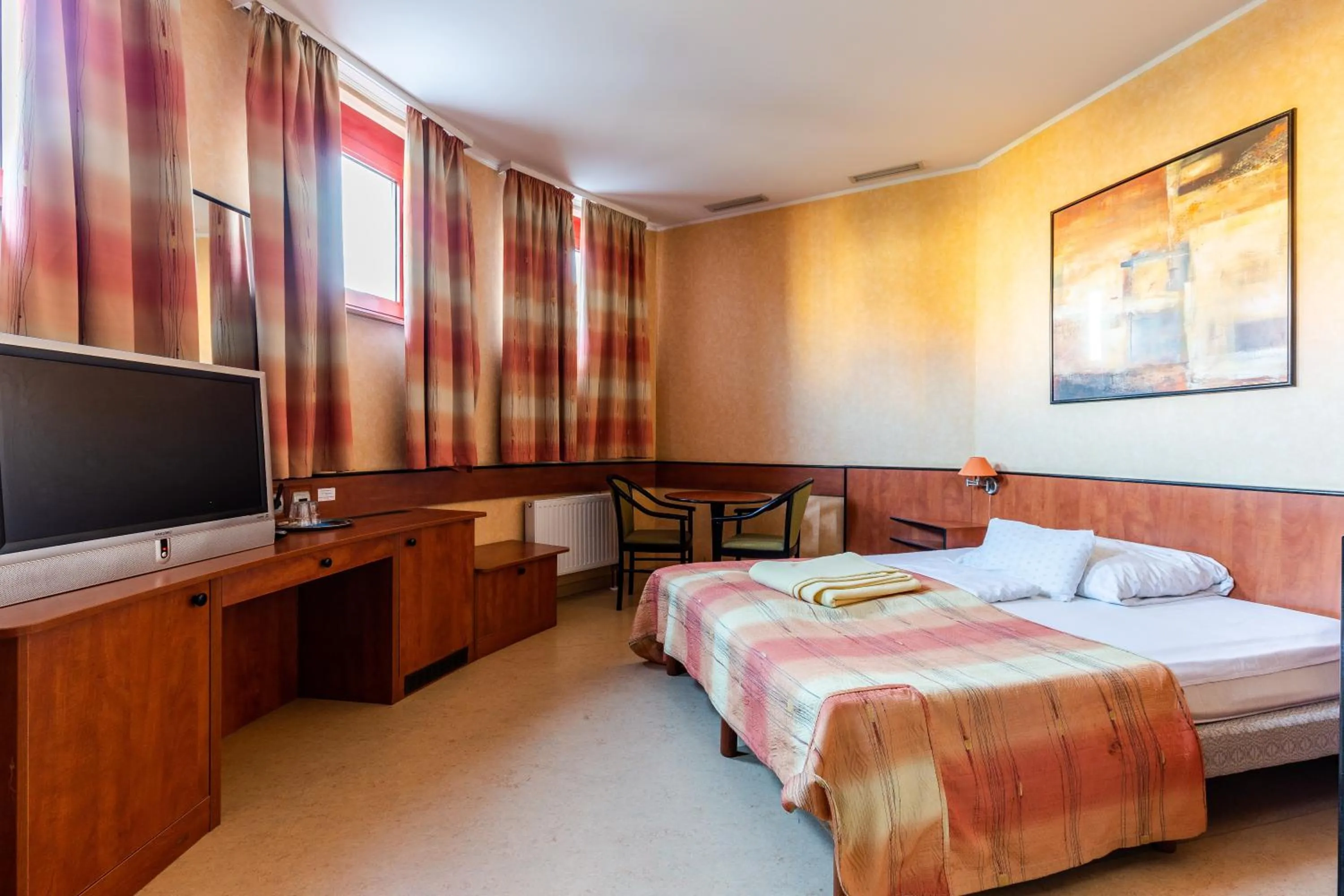 Bed in Corner Motel