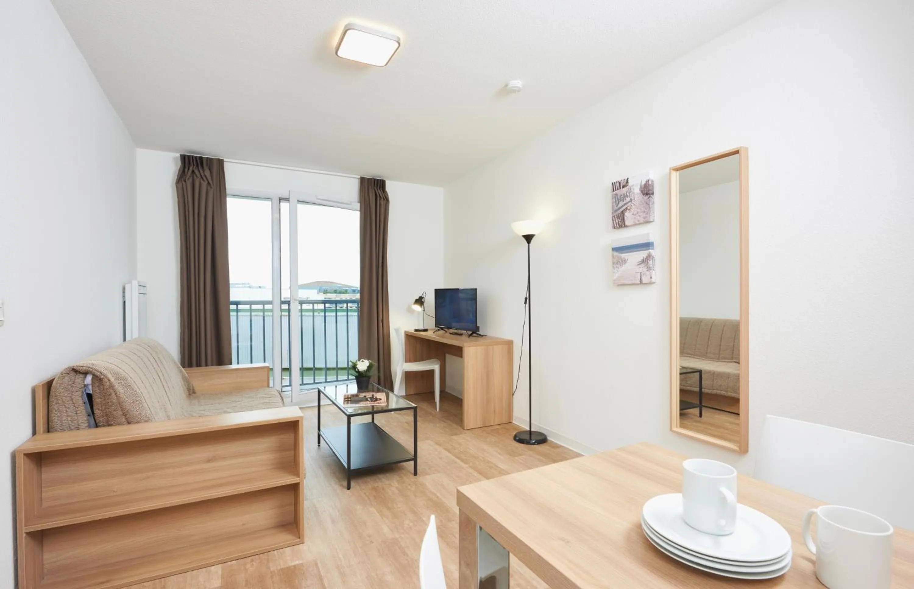 Living room in Ténéo Apparthotel Talence - Centre