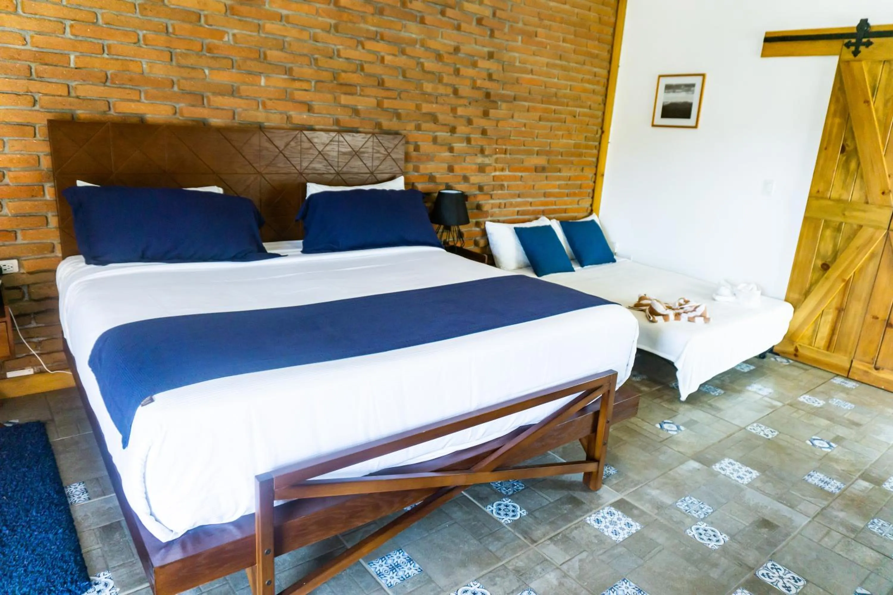 Bed in OJO AZUL RESORT