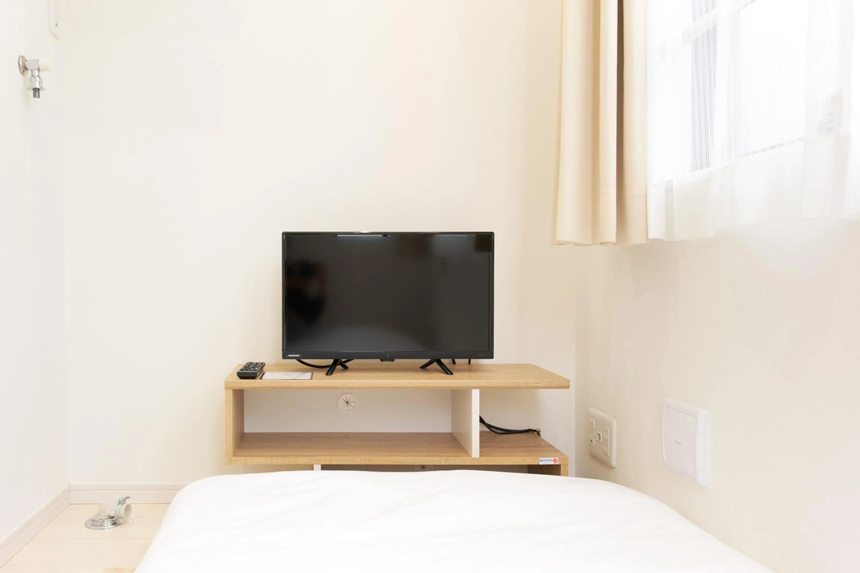 Bed in Nano North Shinjuku Apartment by Tranova