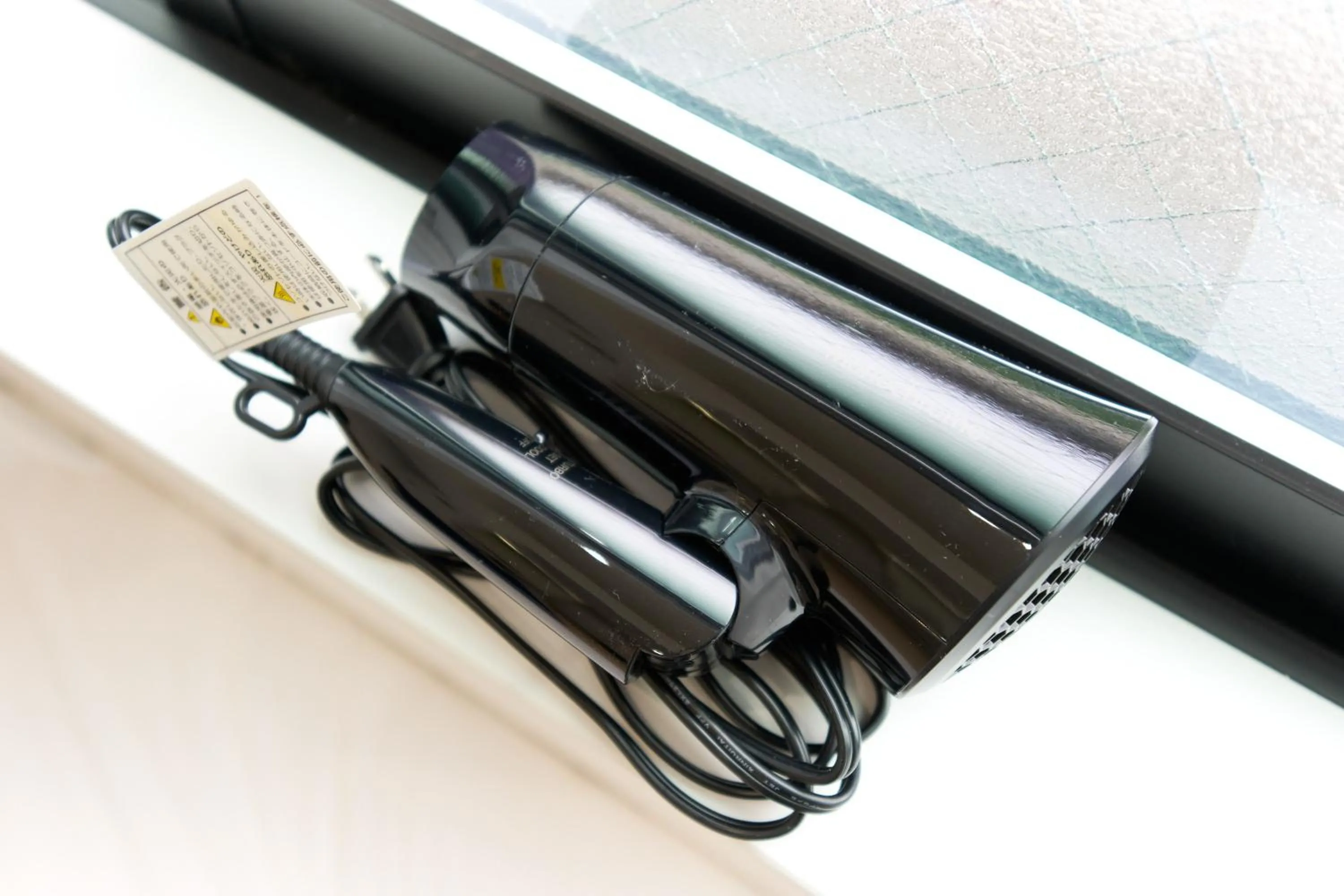 hair dryier in Nano North Shinjuku Apartment by Tranova