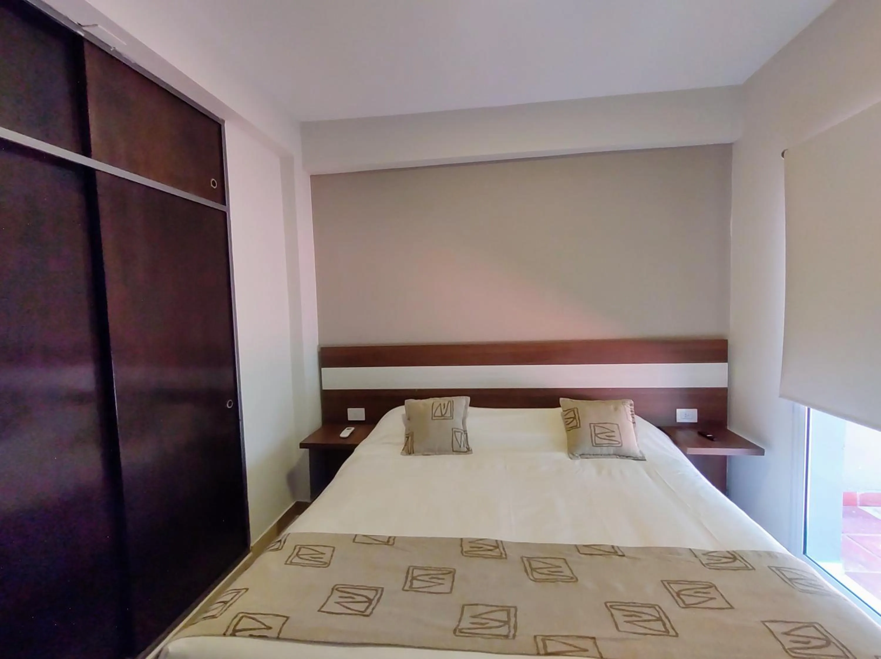 Bed in Urquiza Suites Salta