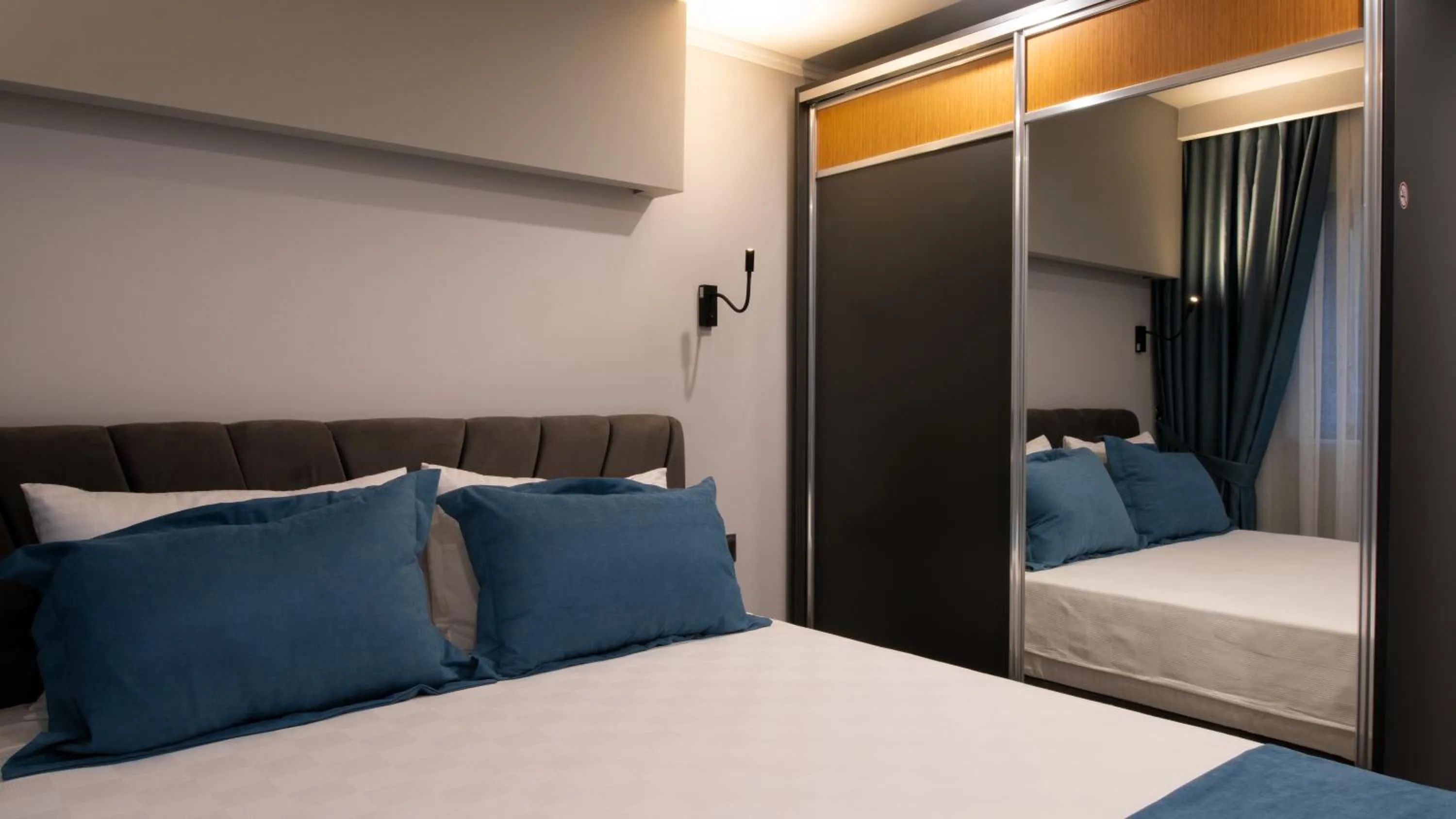 Bed in OPERA SUITES Apart Hotel