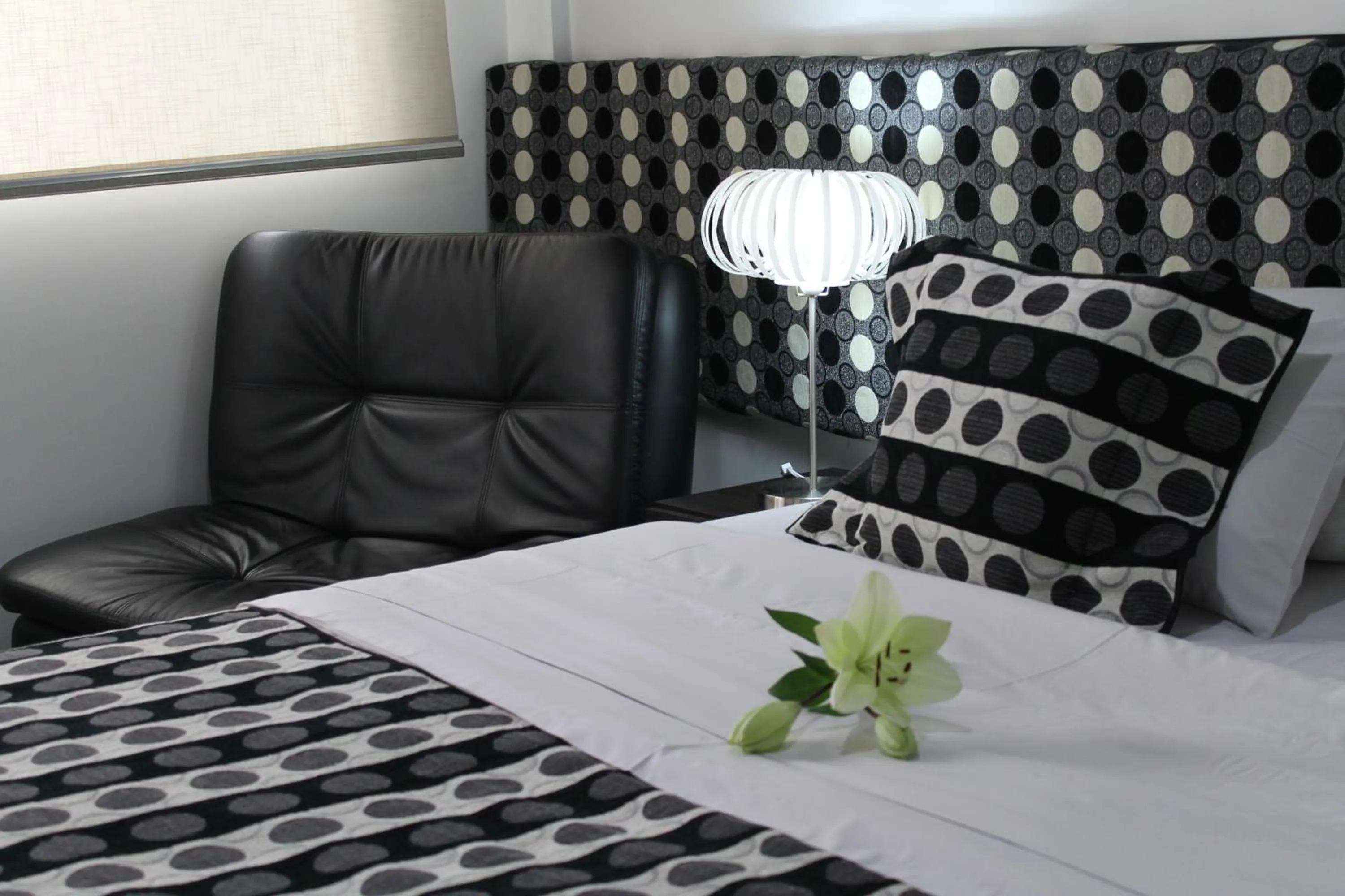 Living room, Bed in La Cabrera Hotel Boutique