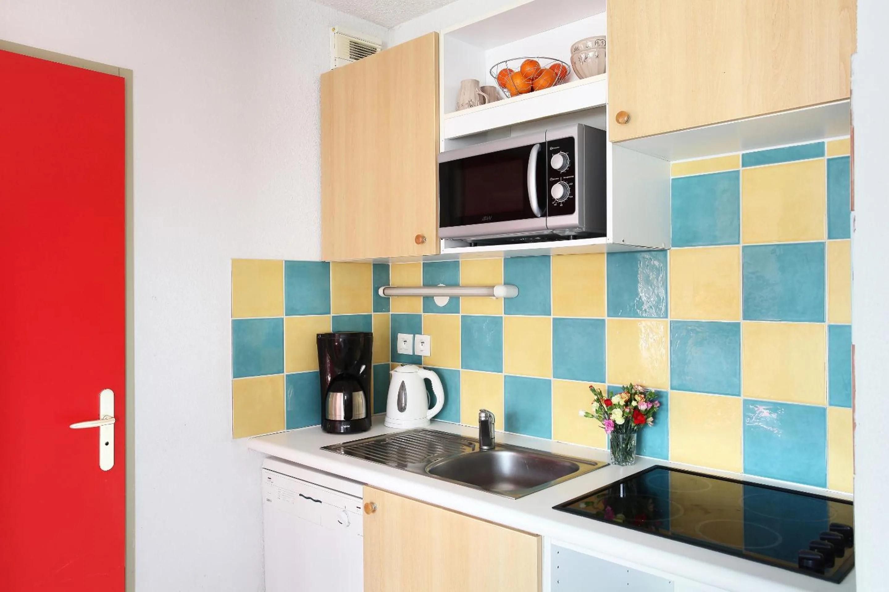 Kitchen or kitchenette in Résidence Odalys Belle Vue