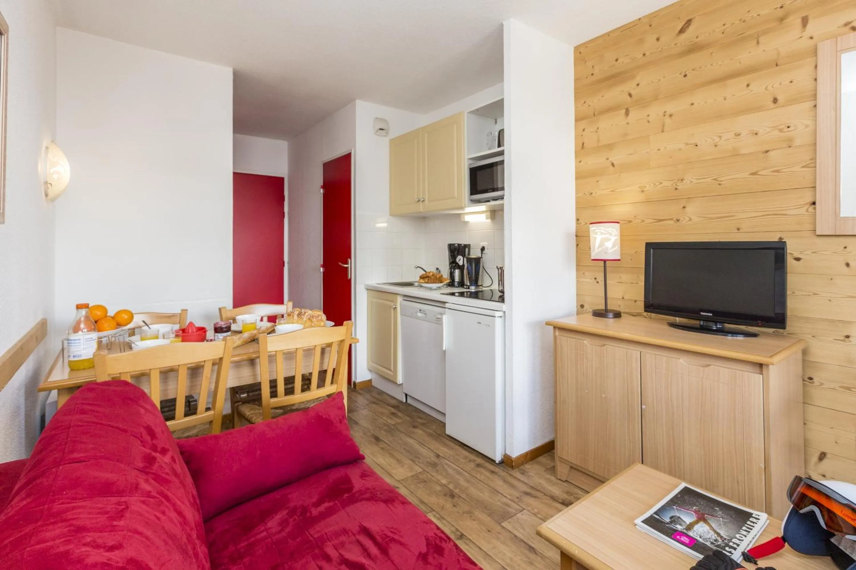 Kitchen or kitchenette in Résidence Odalys Les Lumières de Neige