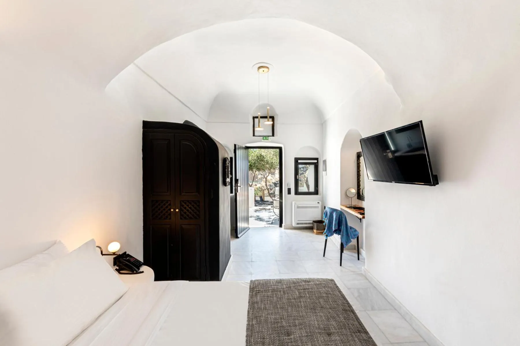 Photo of the whole room in Pearl of Caldera Oia - Boutique Hotel by Pearl Hotel Collection