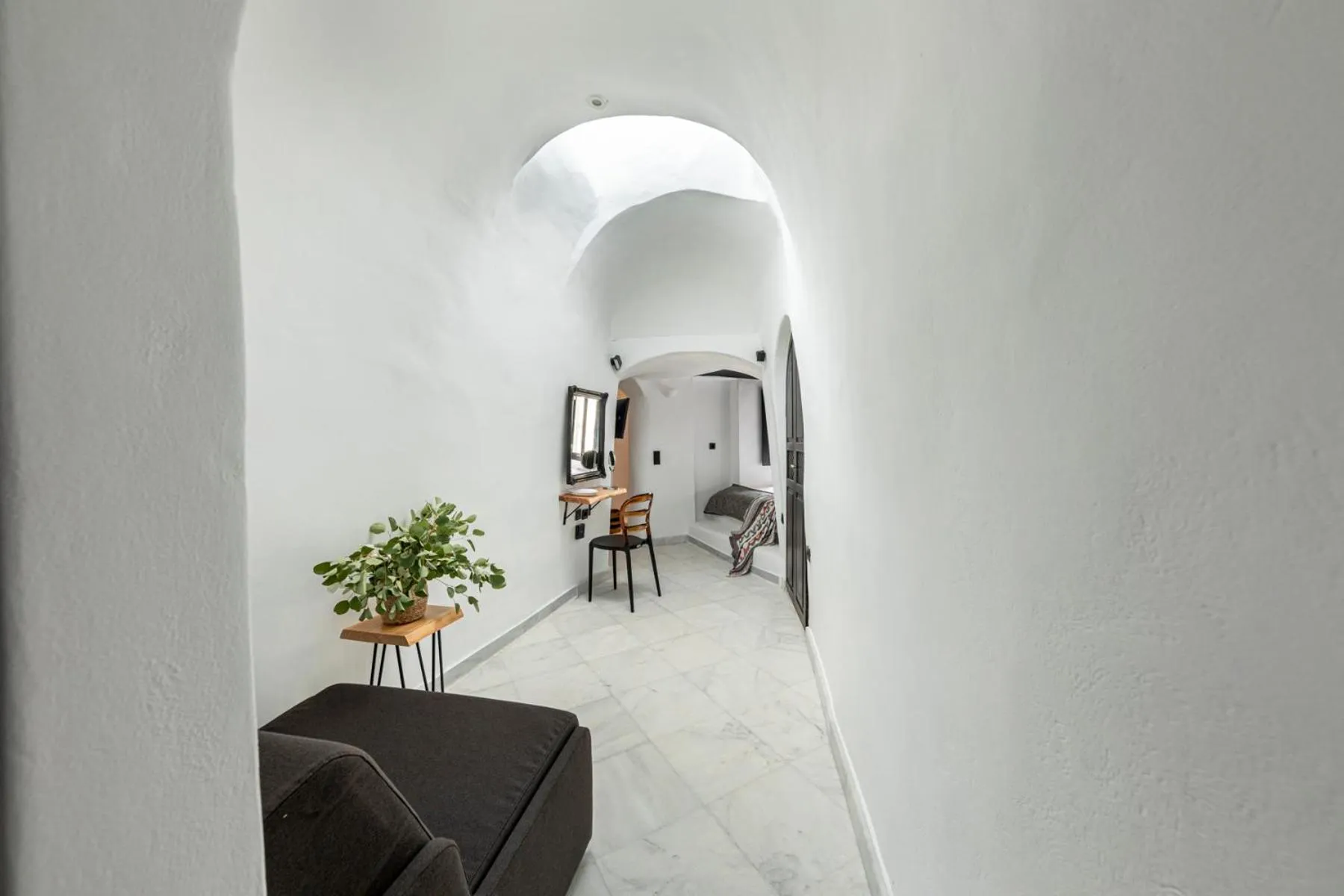 Photo of the whole room in Pearl of Caldera Oia - Boutique Hotel by Pearl Hotel Collection