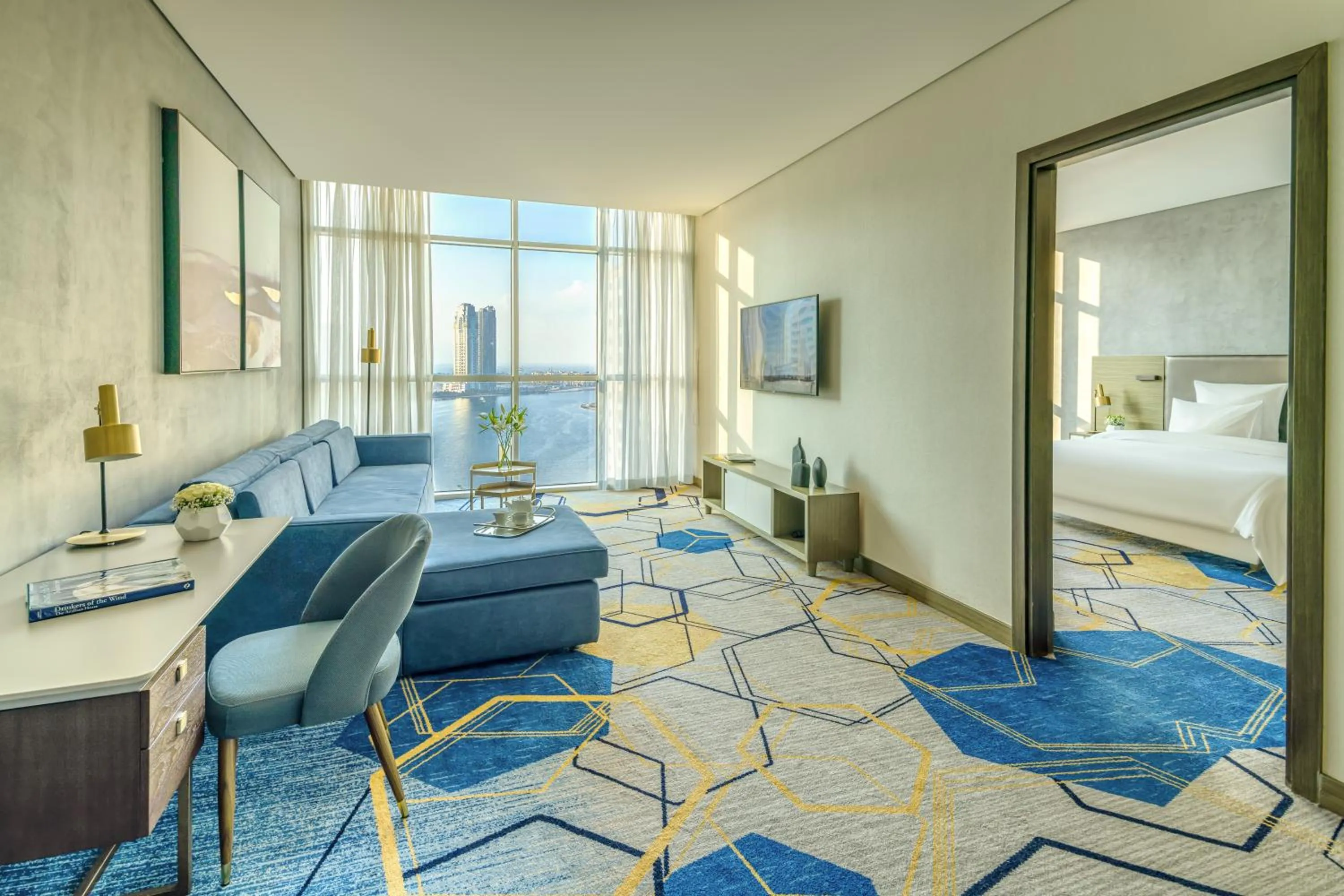 Living room, Bed in Pullman Sharjah