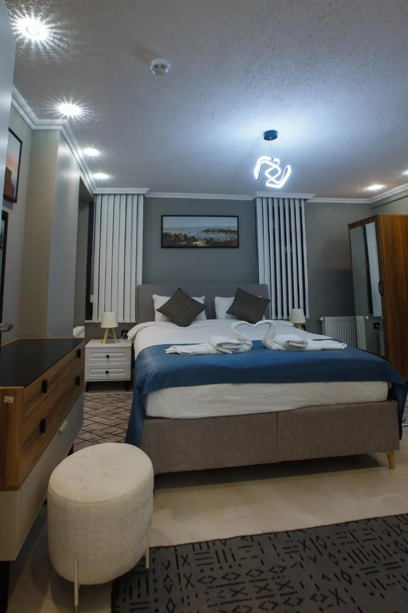 Photo of the whole room, Bed in Stone Suites