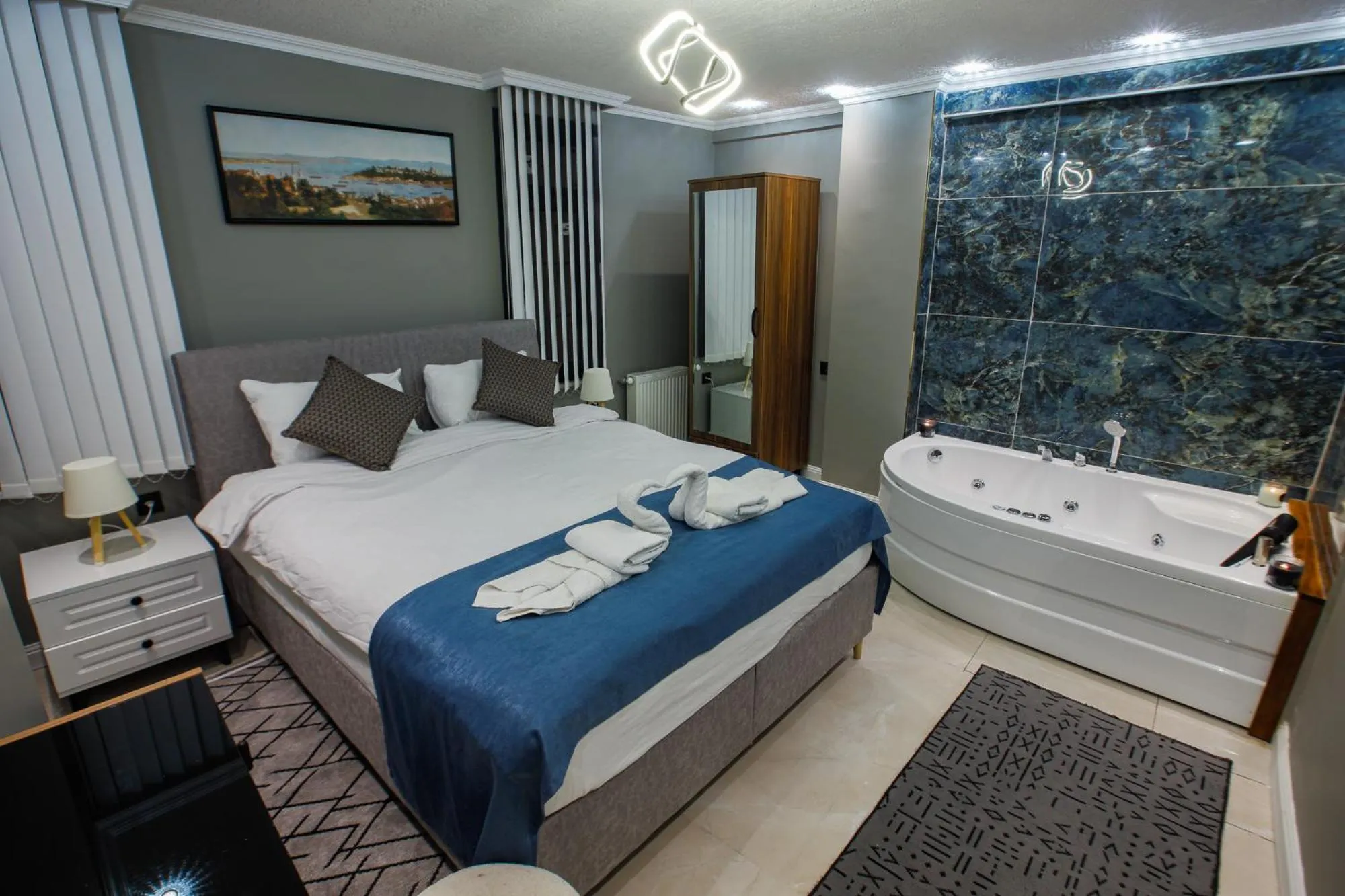 Bath, Bed in Stone Suites