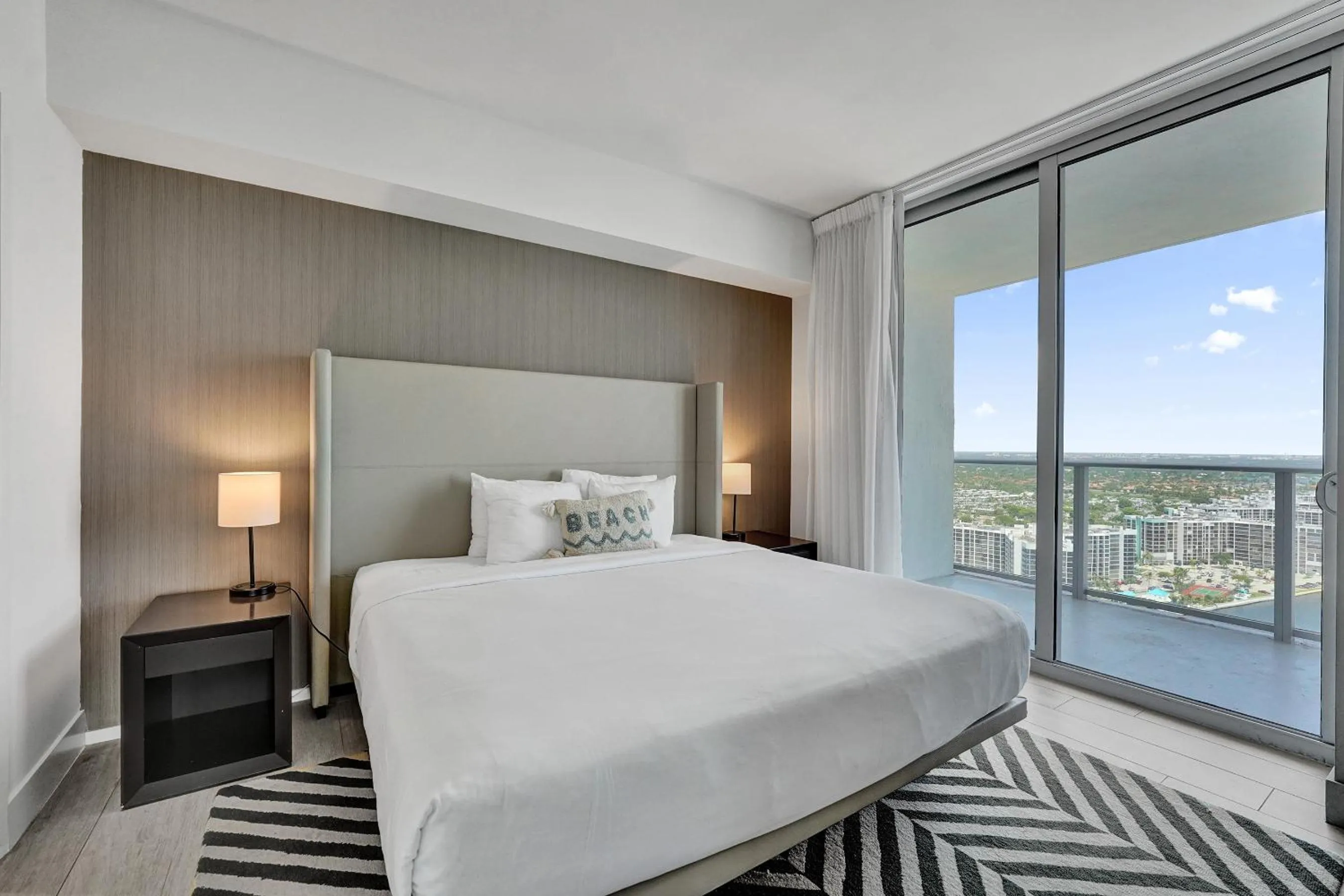 Bed in Amazing Apartments at H Beach House