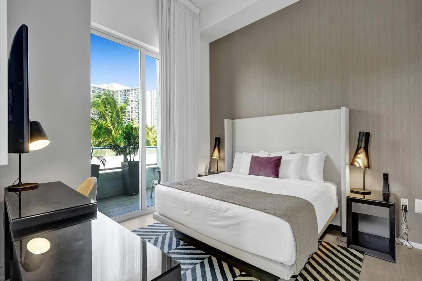 Bed in Amazing Apartments at H Beach House