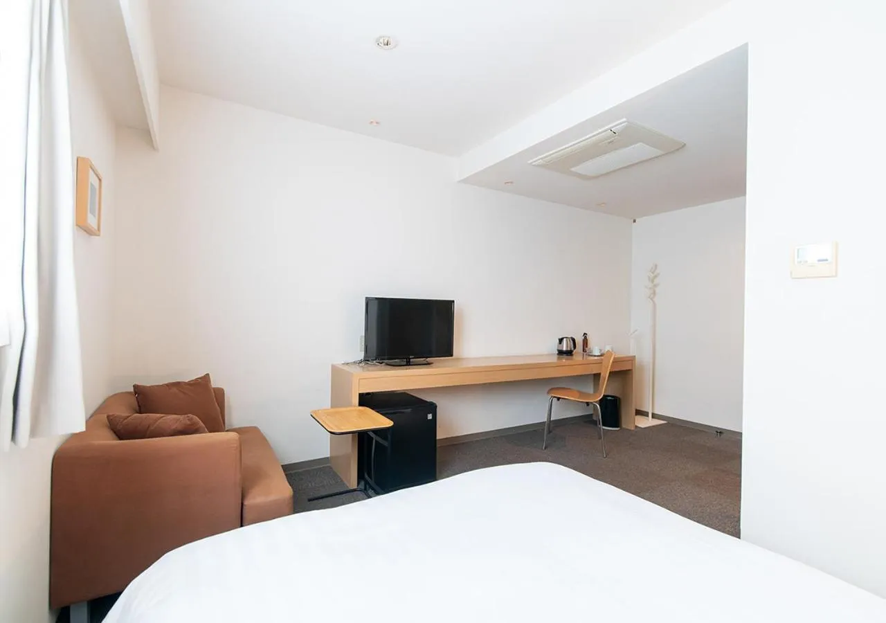 Photo of the whole room, Bed in Hotel day by day