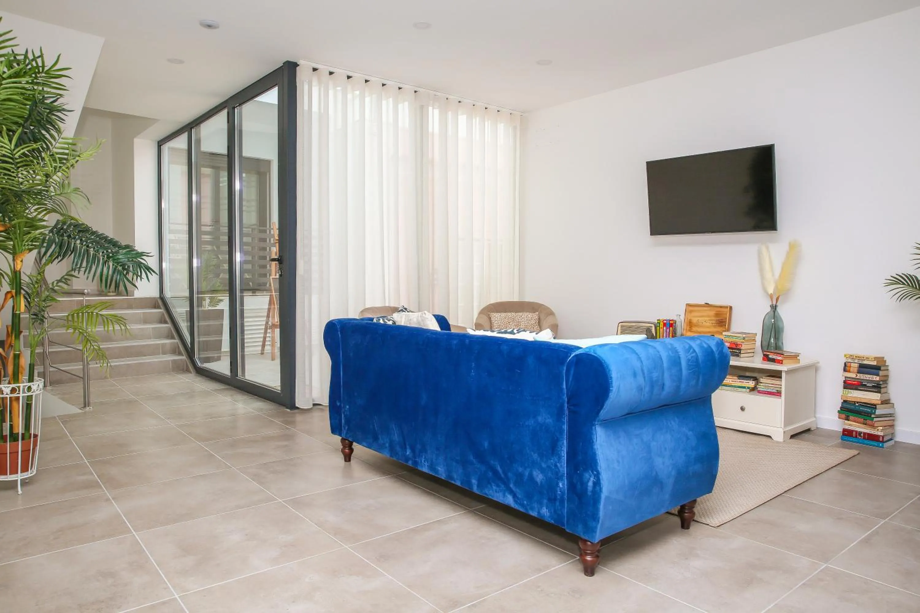 Communal lounge/ TV room in Pata da Gaivota Boutique House