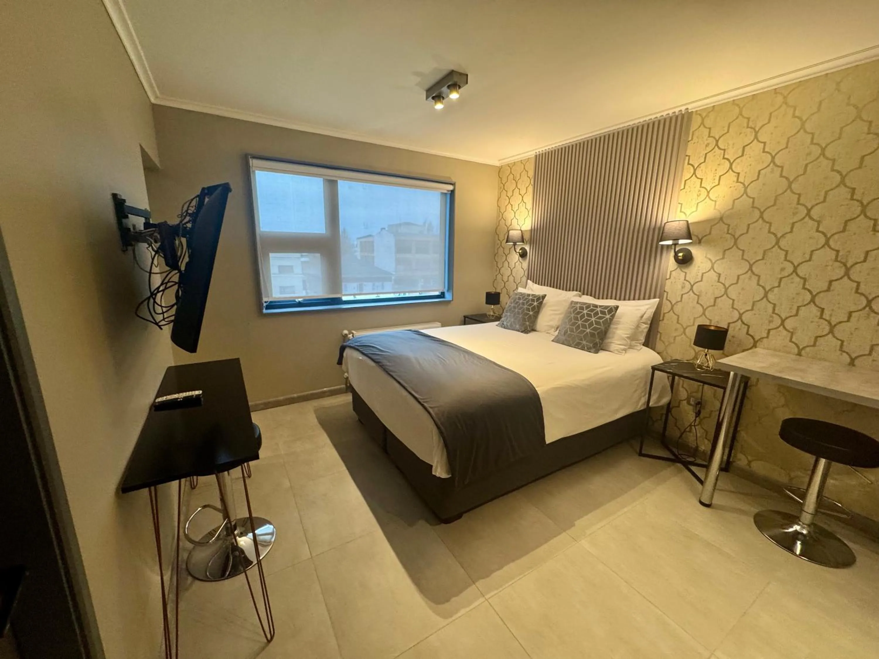 Bed in Patagonia Hotel & Apart Suite